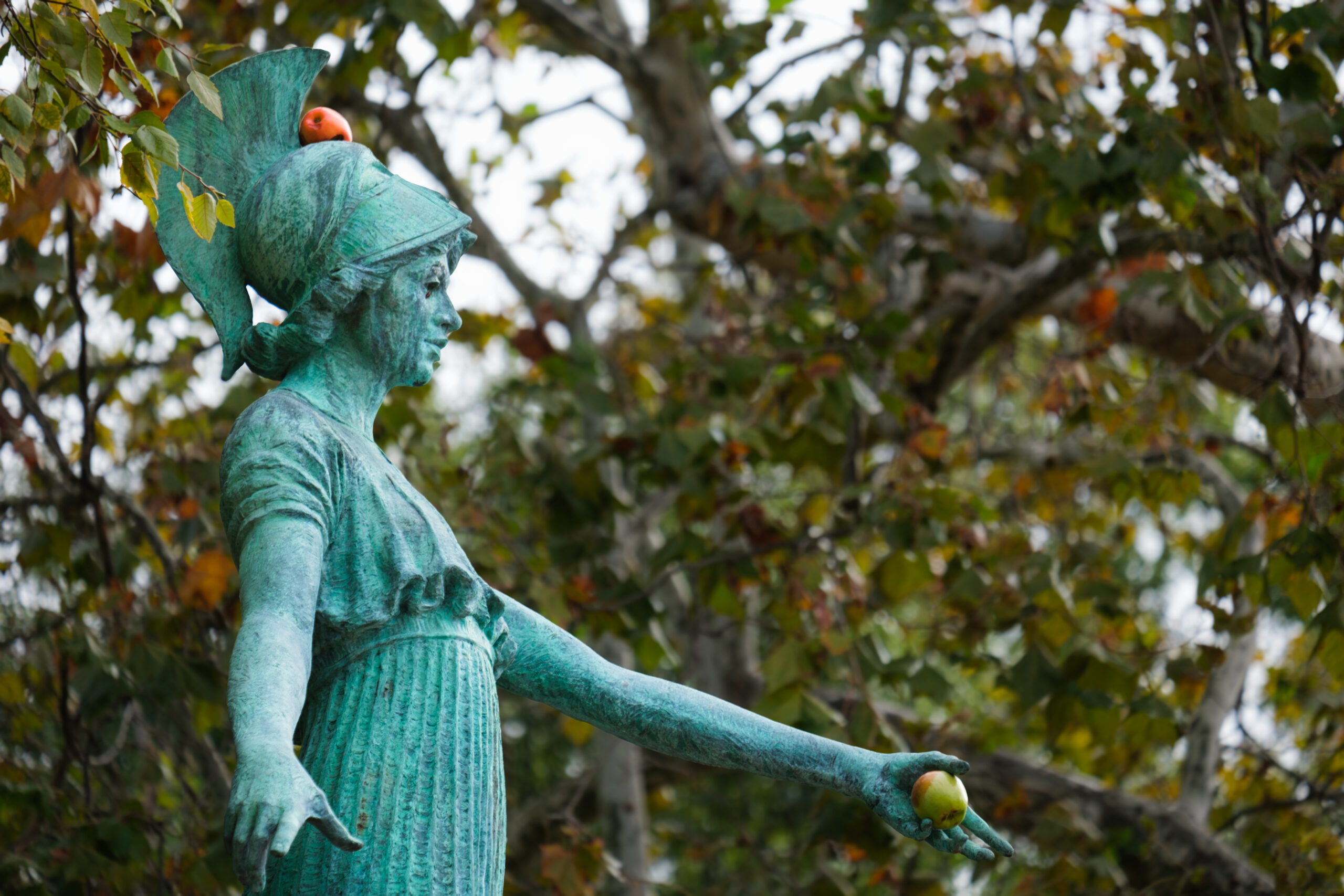 The UNCG Minerva statue holds an apple.