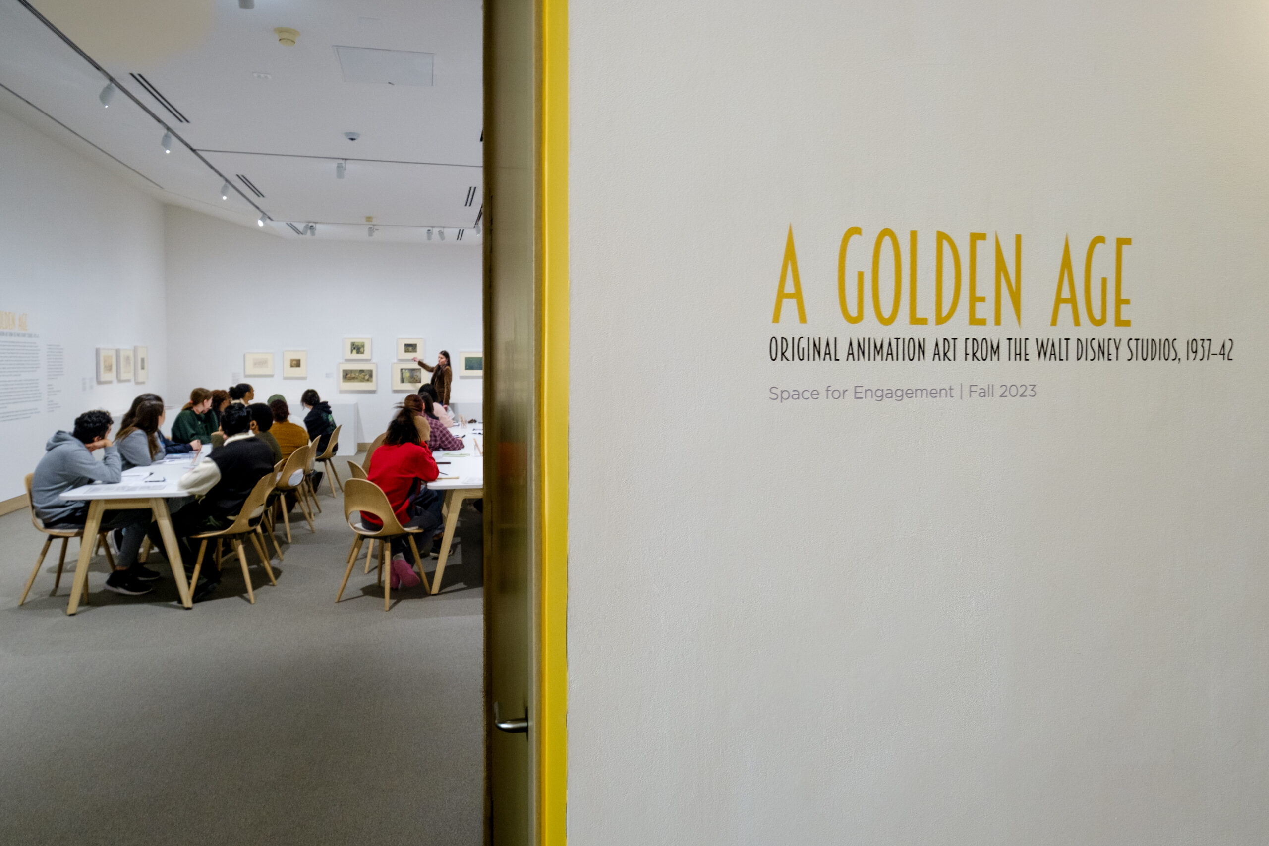 The title of a museum exhibit "The Golden Age" on the wall of the UNCG Weatherspoon Art Museum.