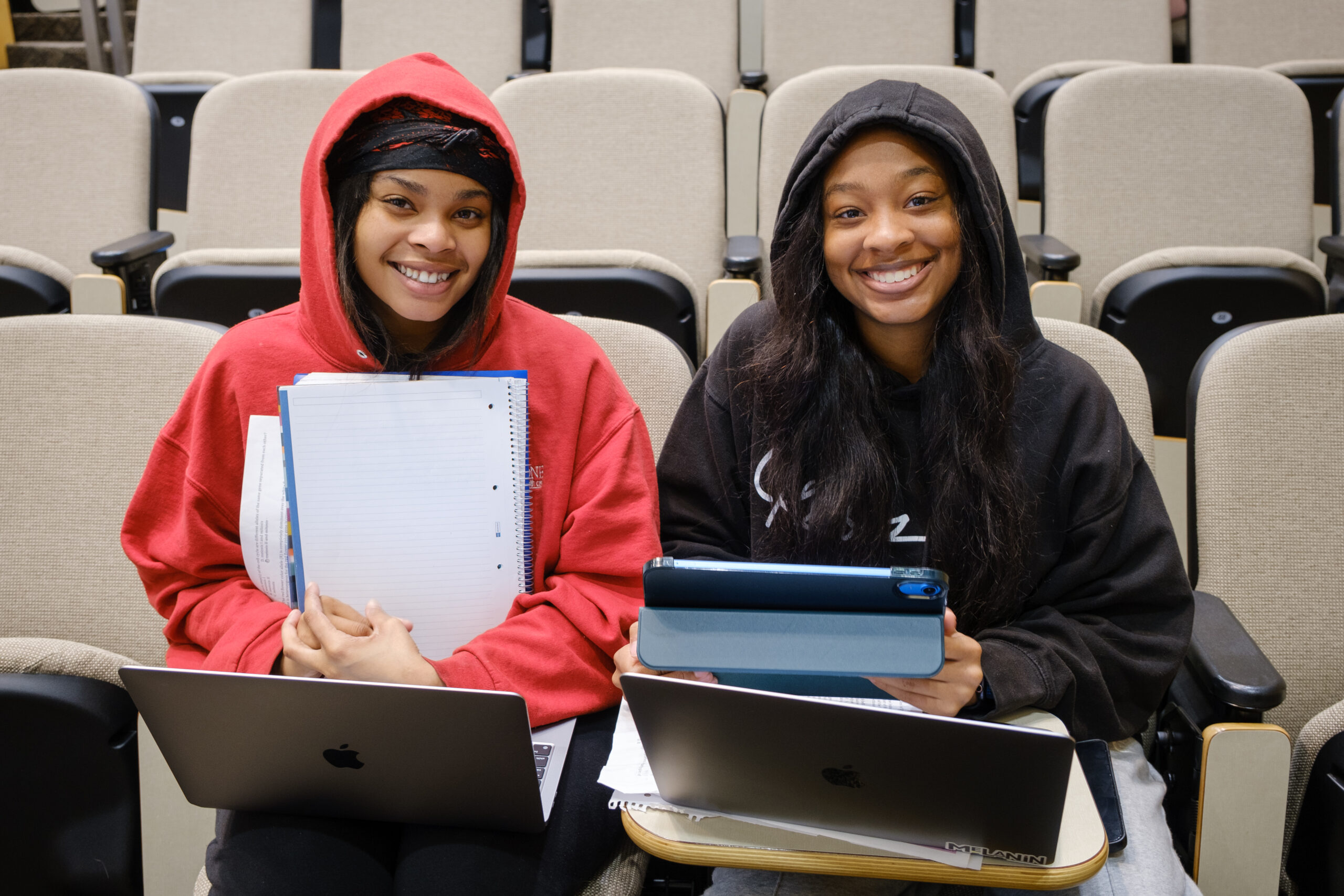 UNCG Juniors Shamonnie Caldwell and J'neya White waiting for the lecture to start in Sullivan Building on Tuesday.