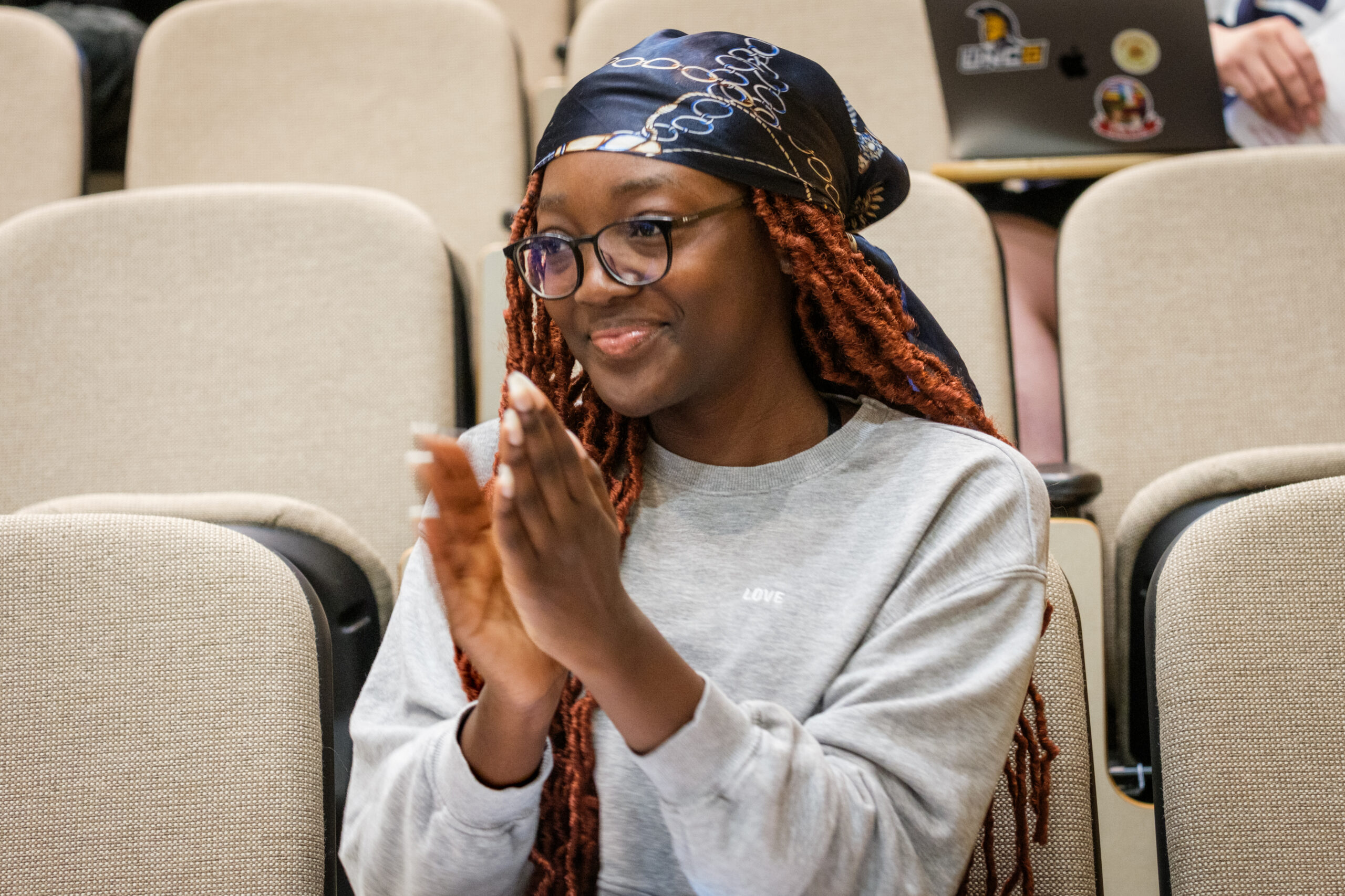 UNCG student smiles in class