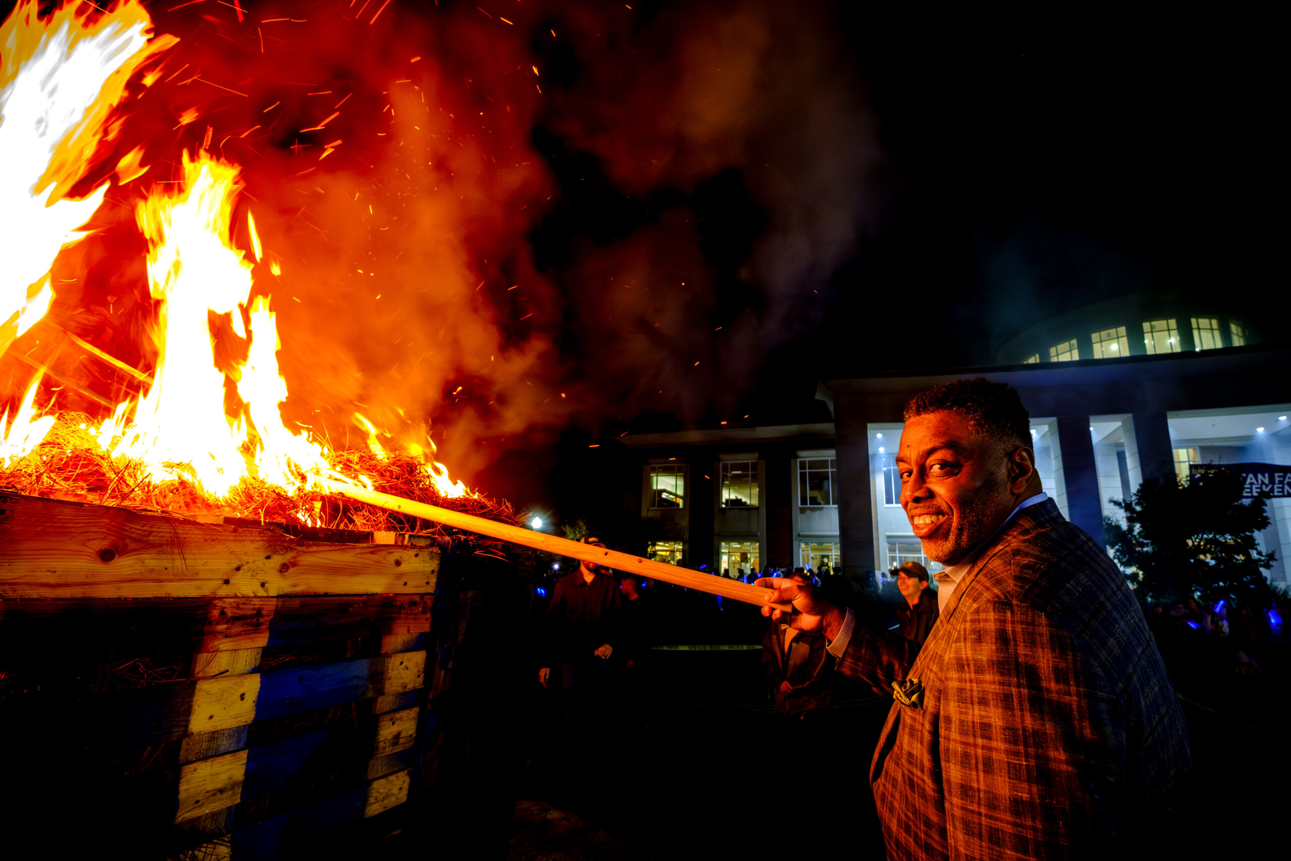 UNCG Chancellor Gilliam lights the 2023 Homecoming bonfire.