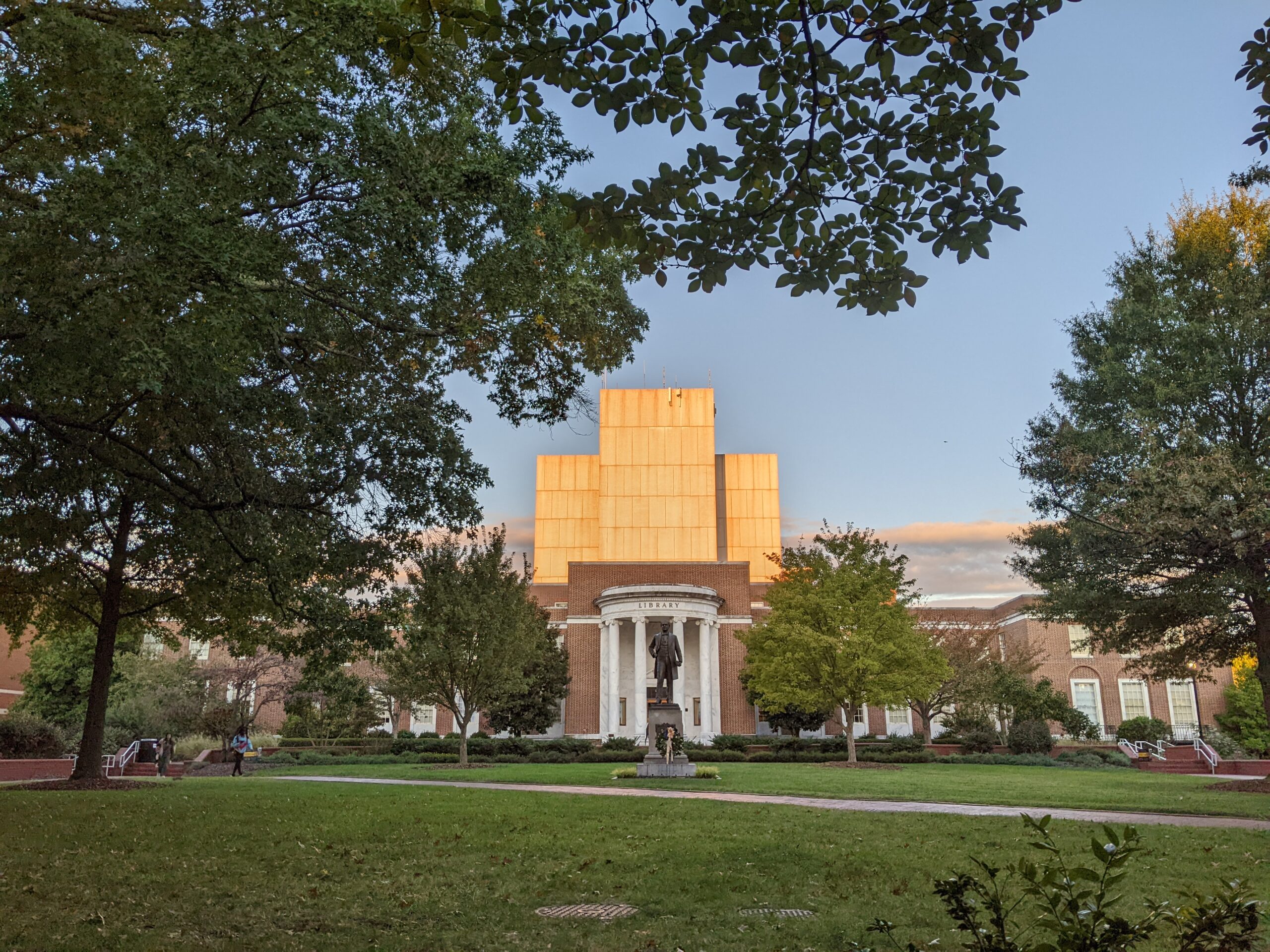 Sunlight reflects off the walls of the UNCG Jackson Library.