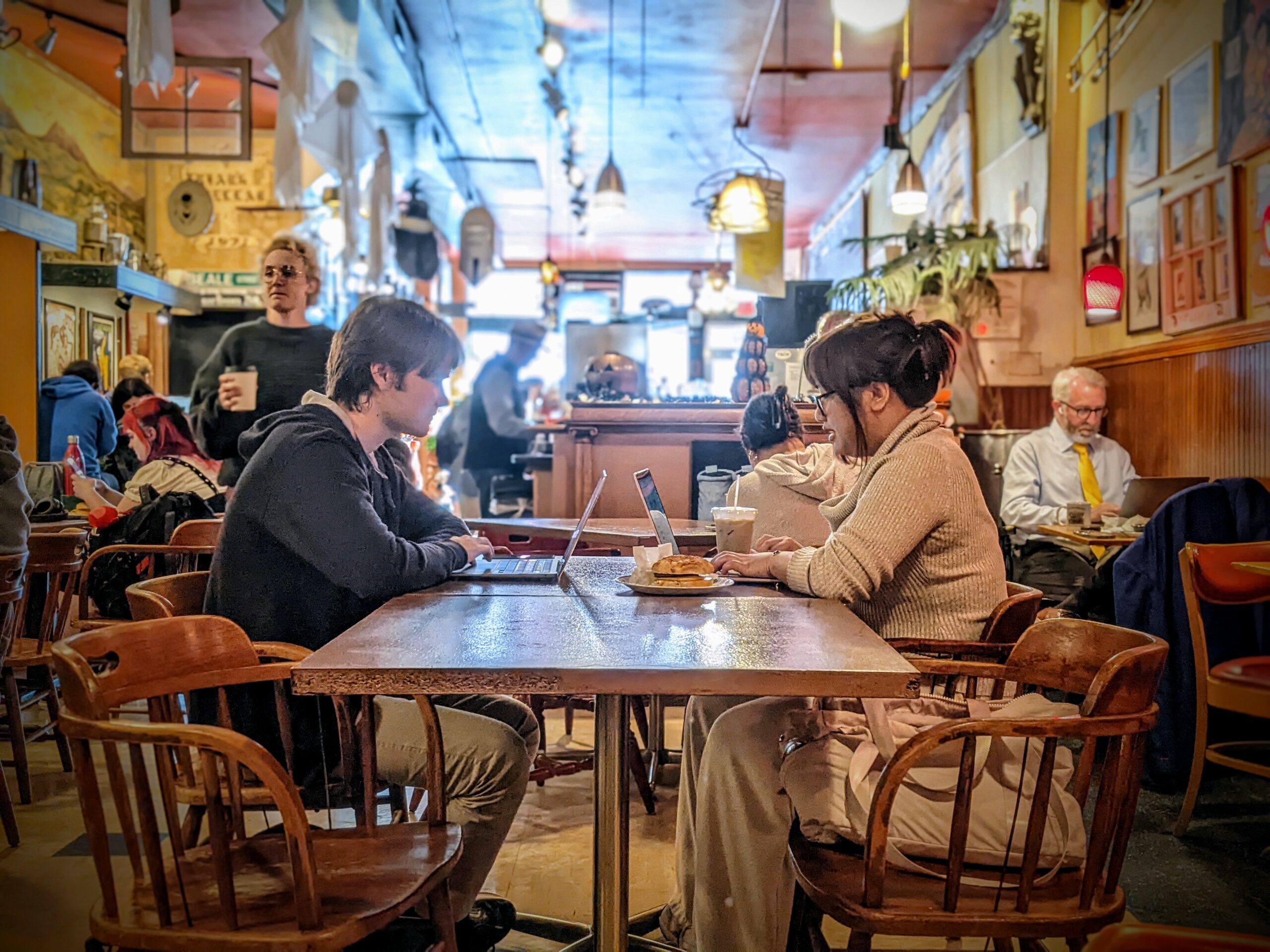 Two students hang out at Tate Street Coffee.