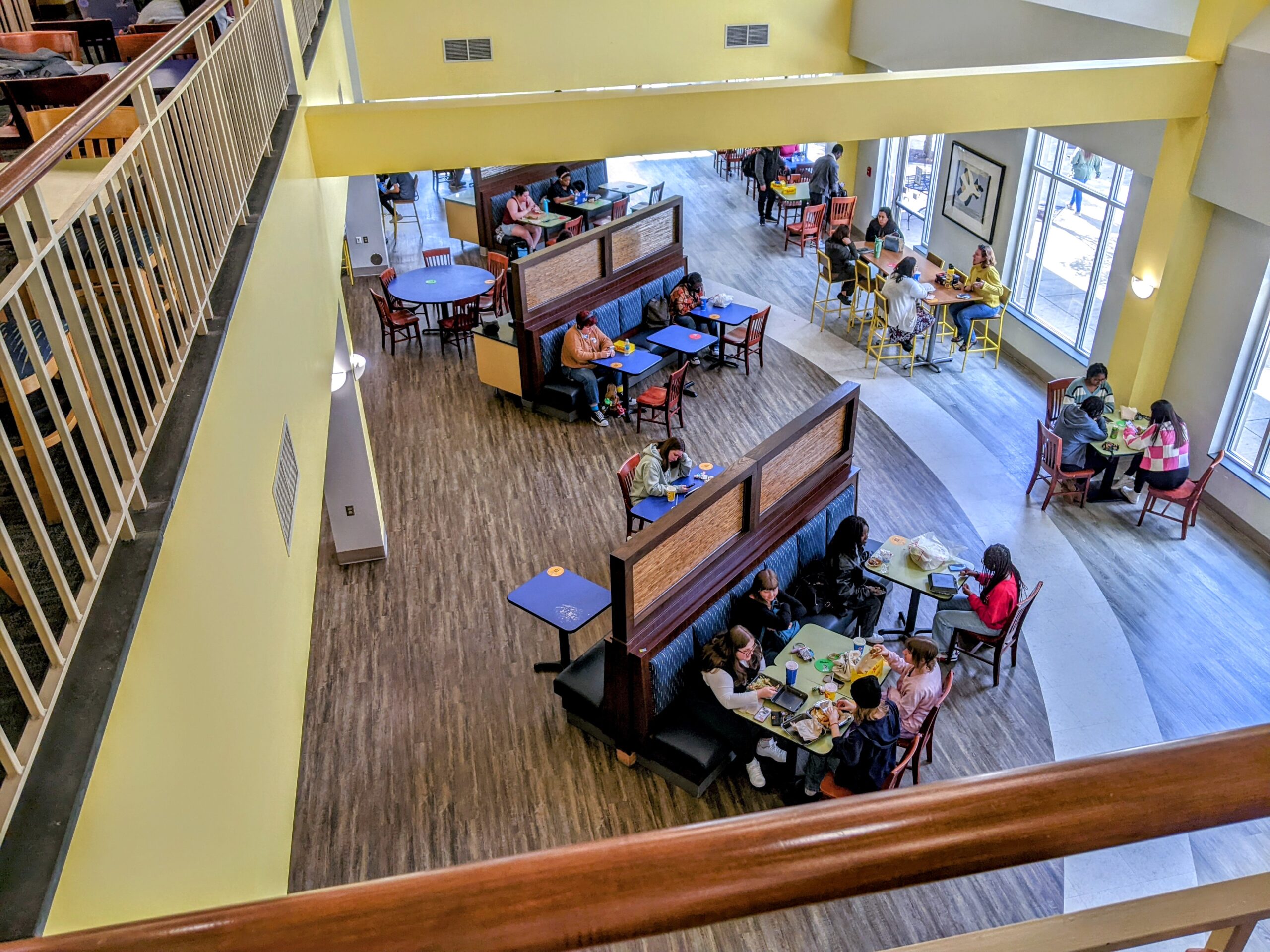 An overhead shot of students eating lunch from UNCG's food court in the EUC.