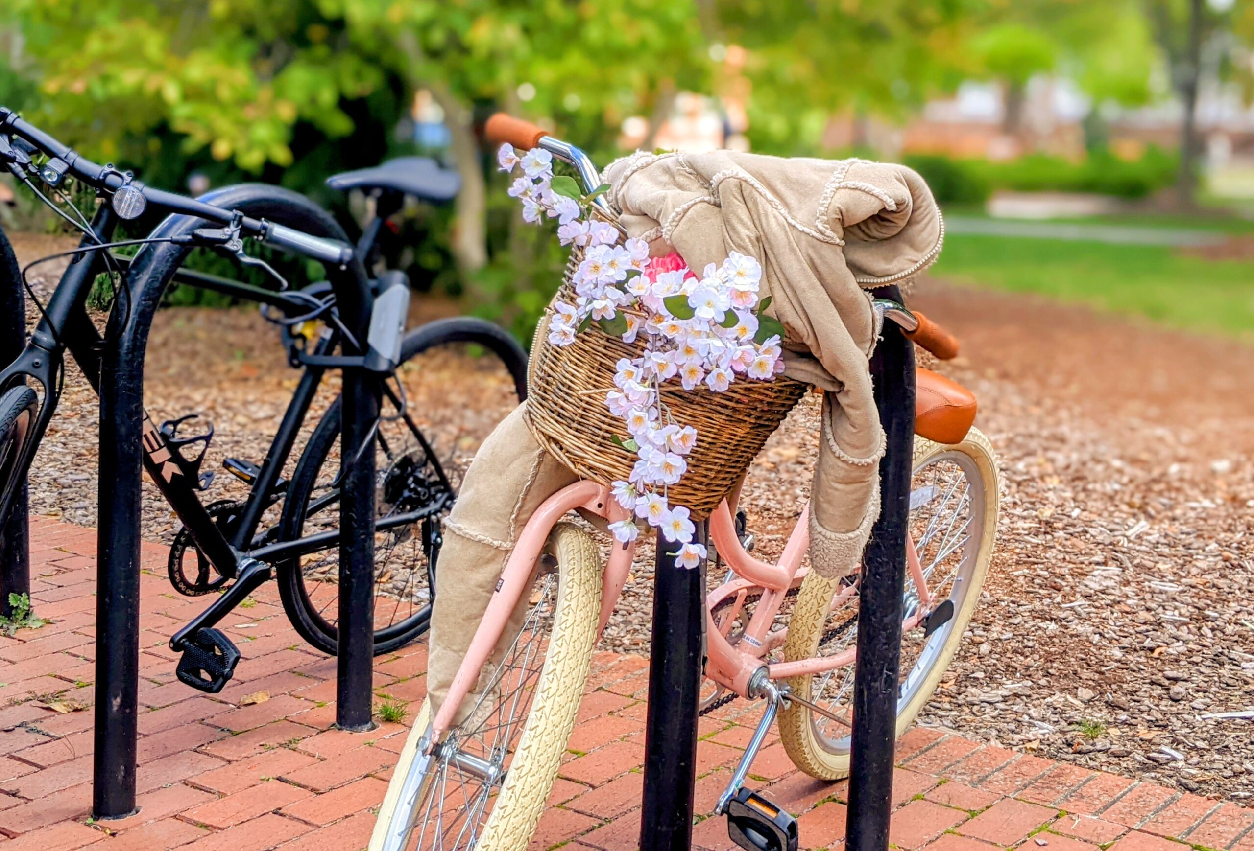 A bicycle with a jacket draped over its handlebars.