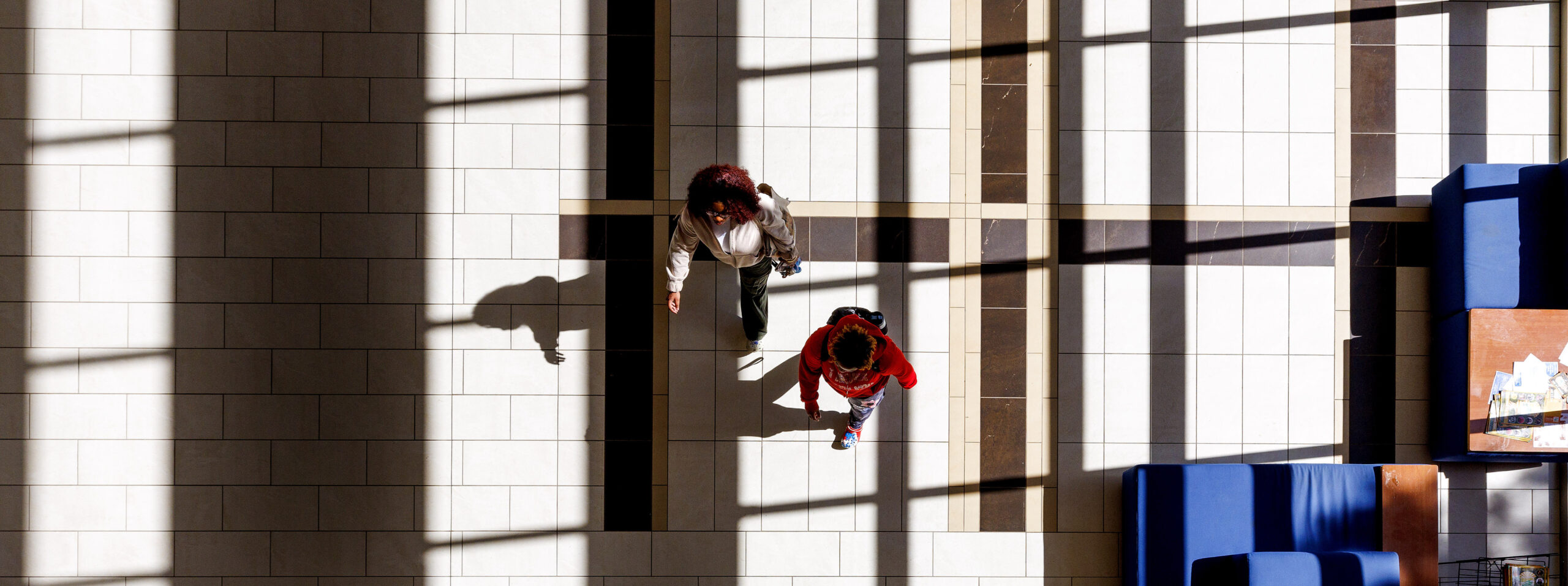 Students walking into the School of Education building.