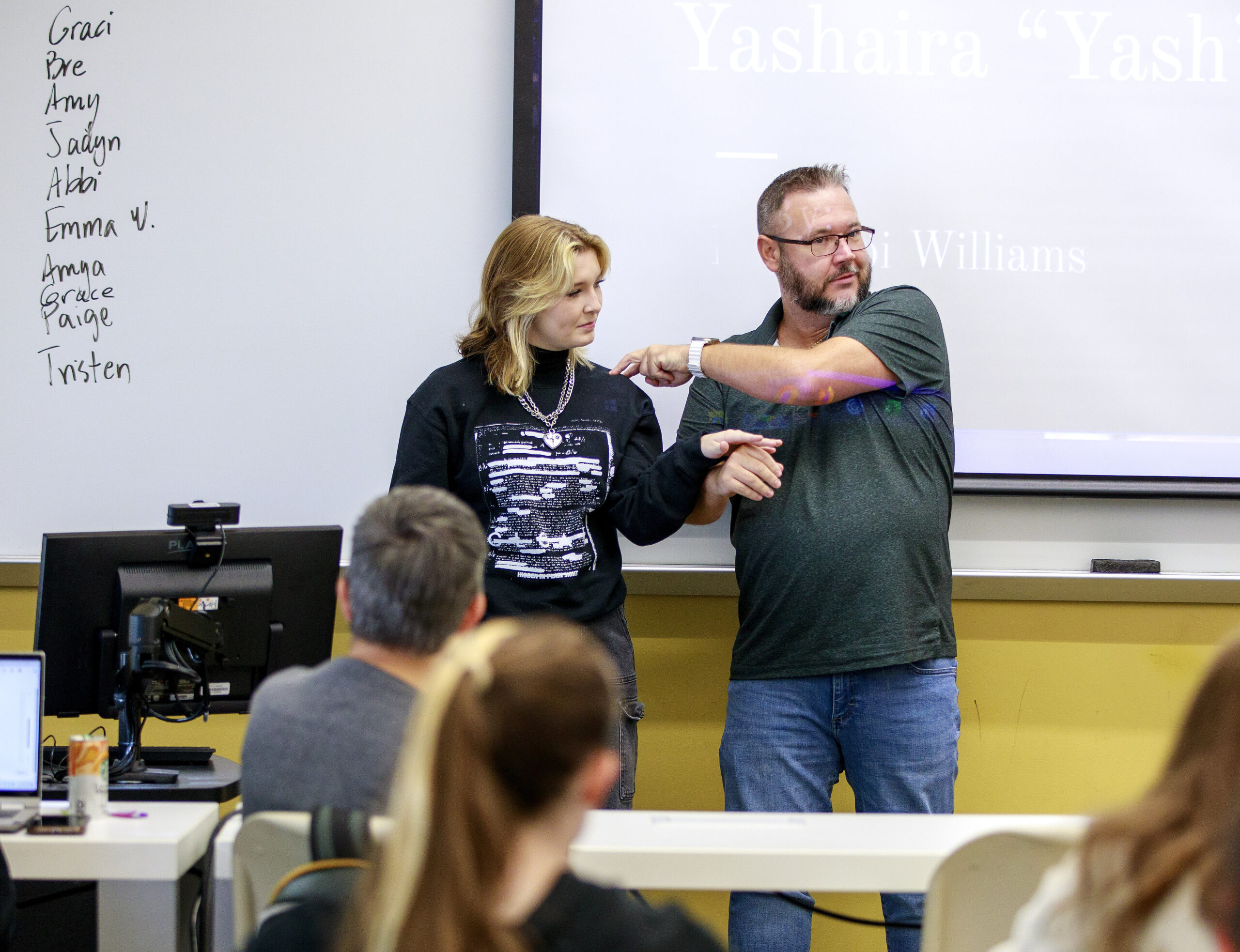 UNCG student Abbi and professor Frankie Griffin do a demonstration at the front of class.