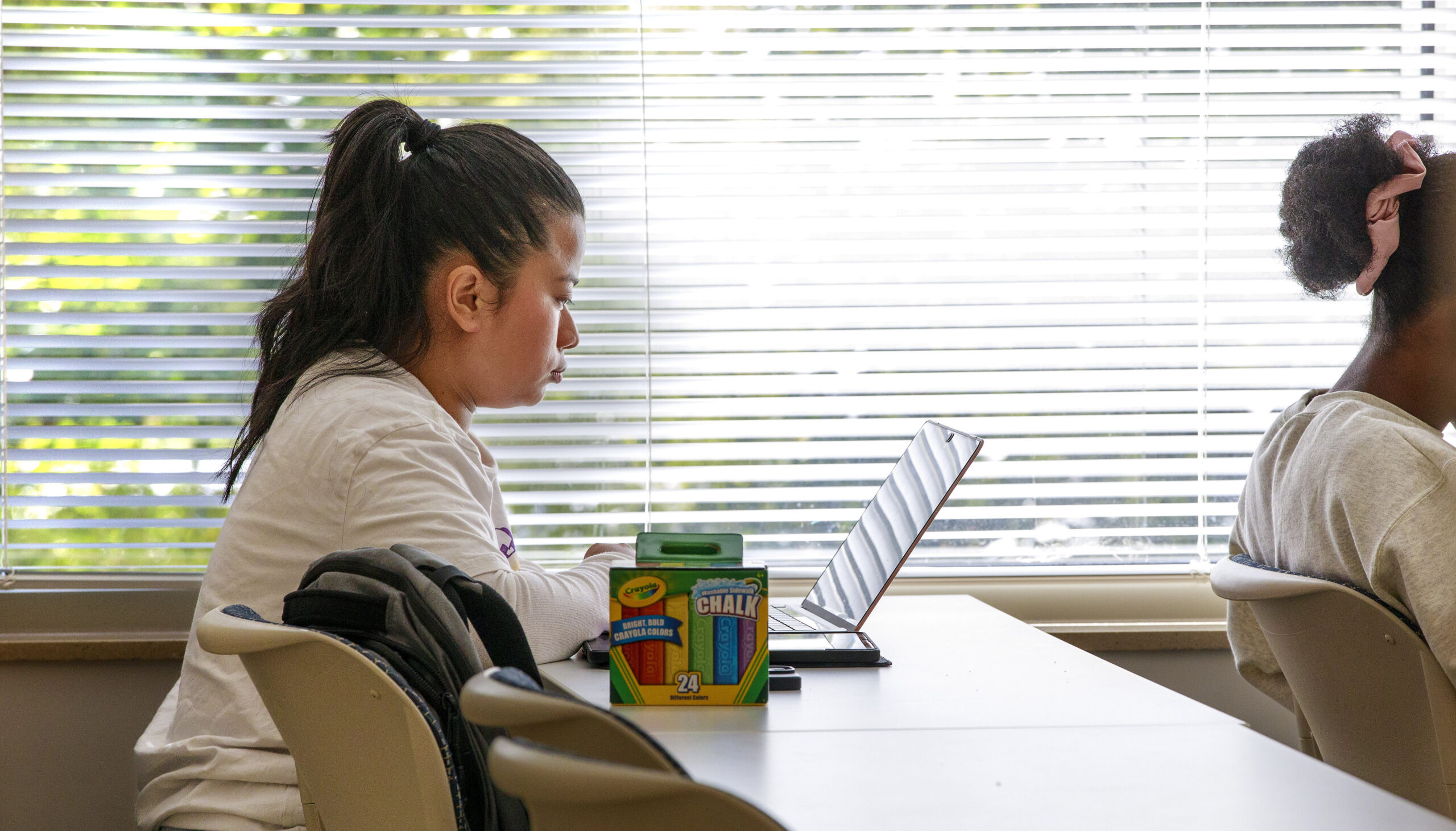 Student takes a quiz in School of Education Building.