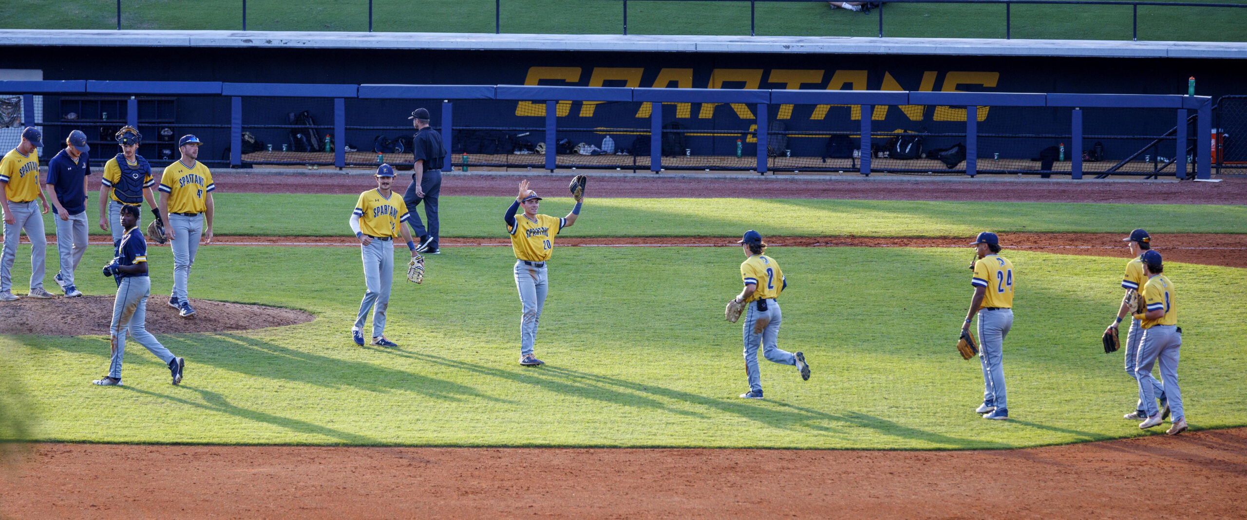 UNCG's baseball team plays on the field.