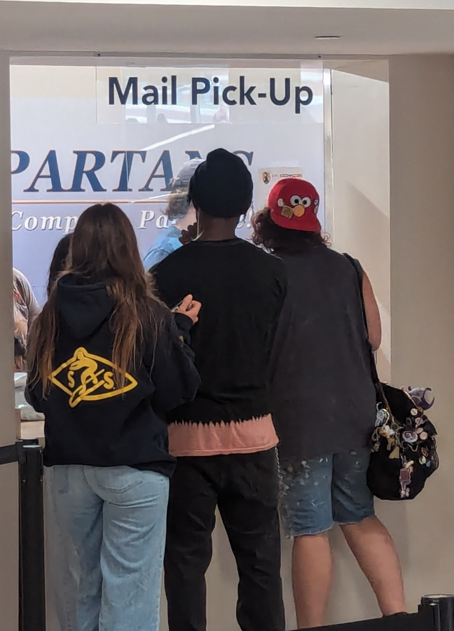 Students in a line to pick up mail on campus.