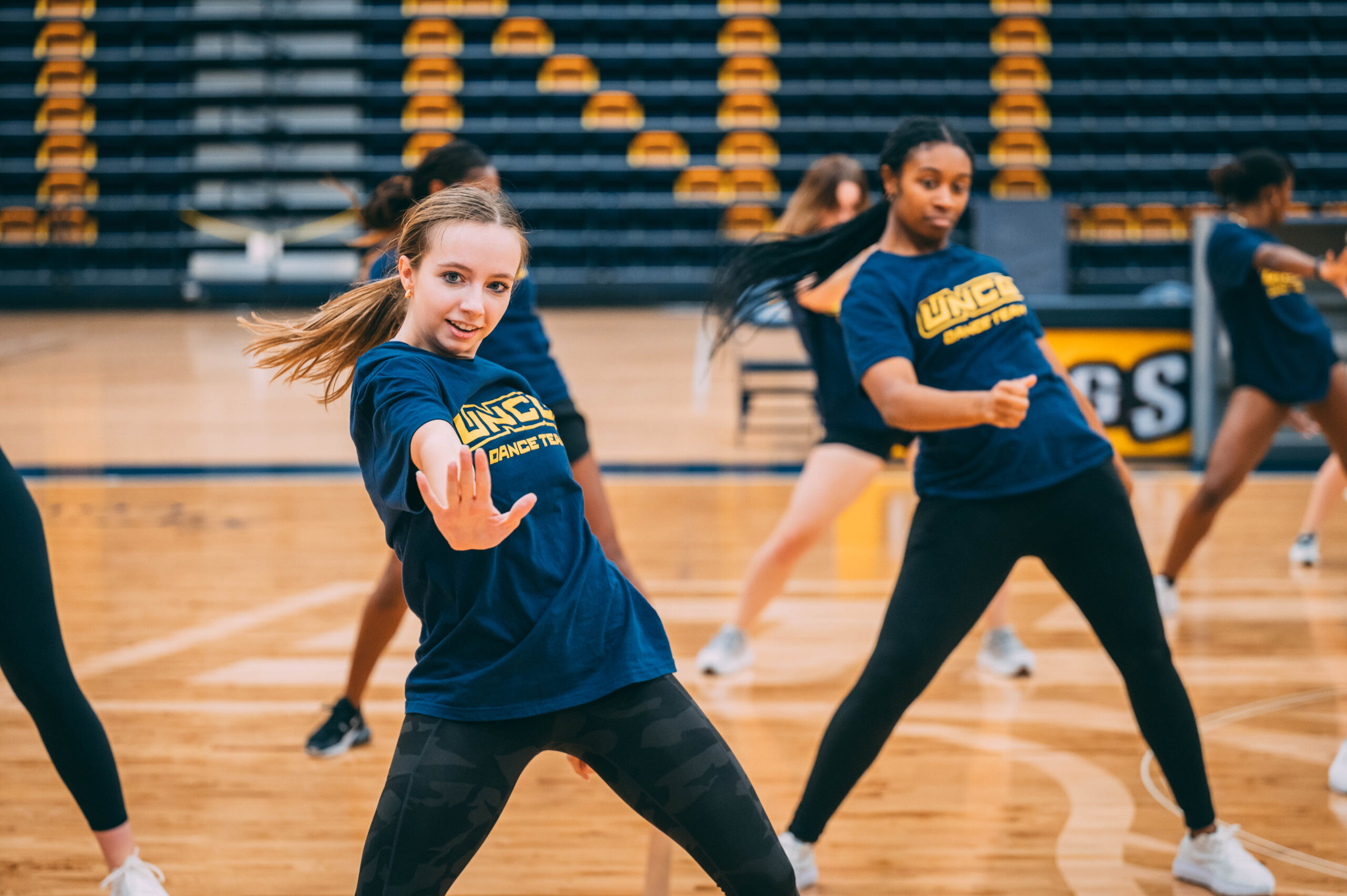 Dance team practices in gym.