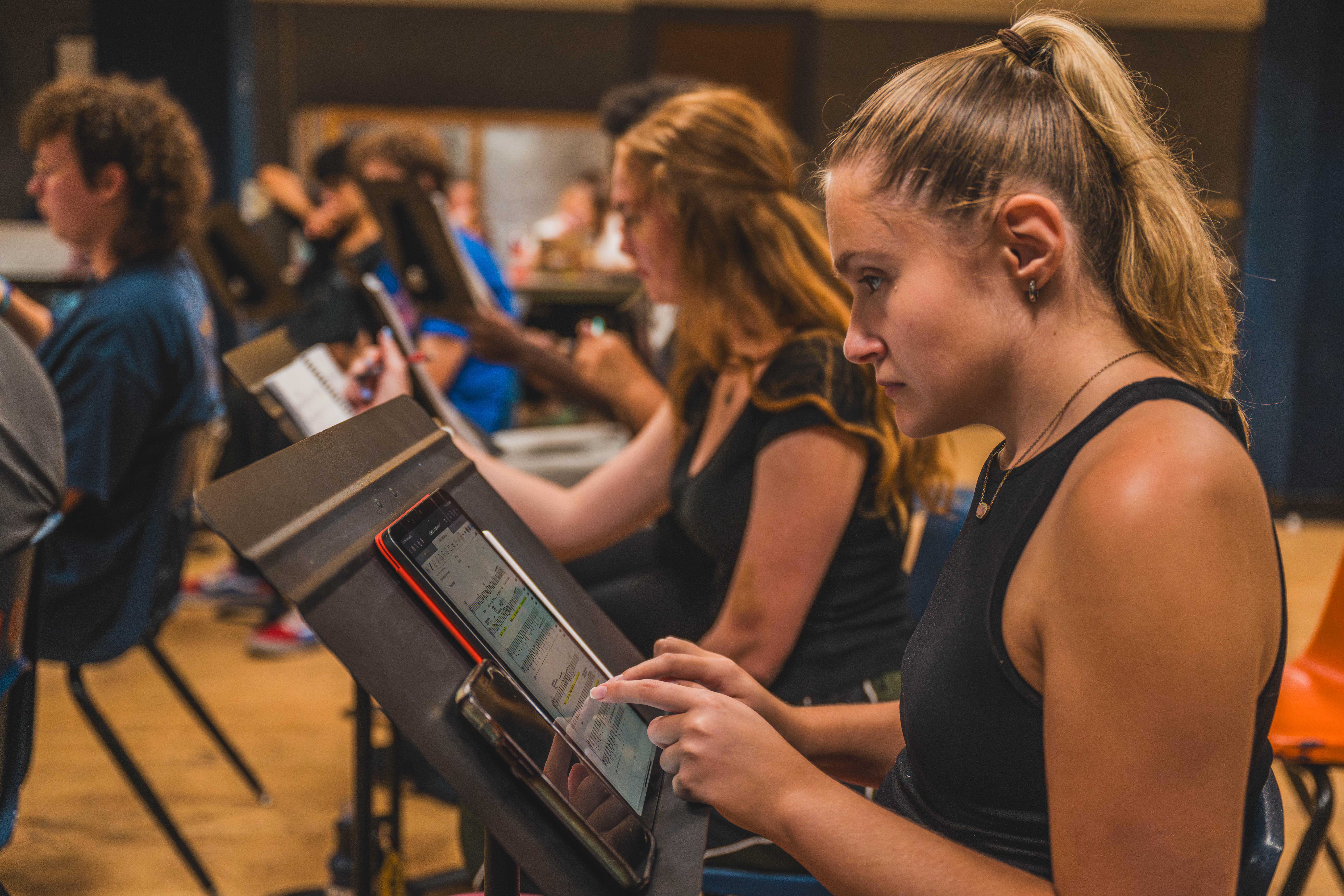 Students look over sheet music.