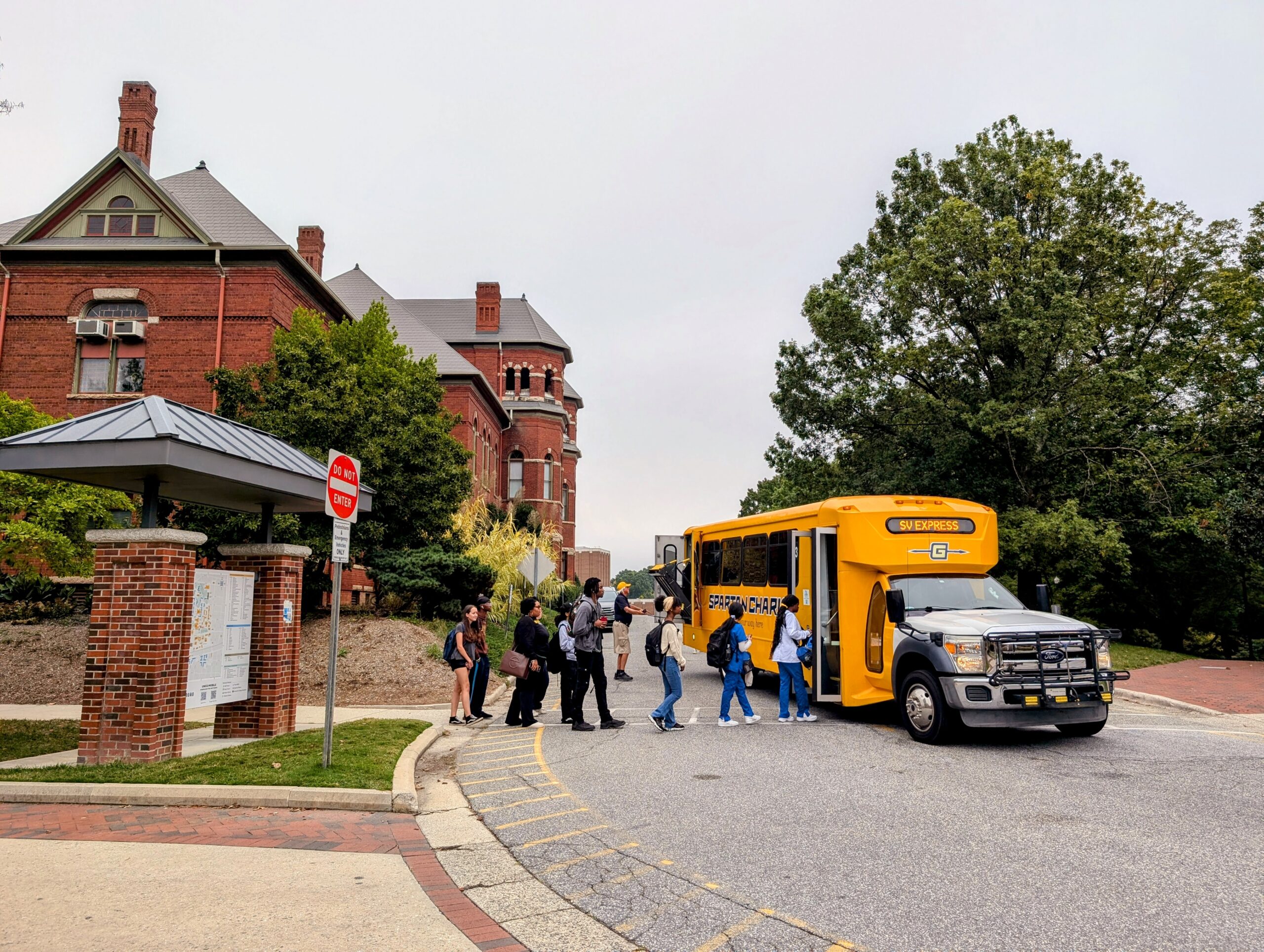 Spartan Chariot bus picks up students on campus.