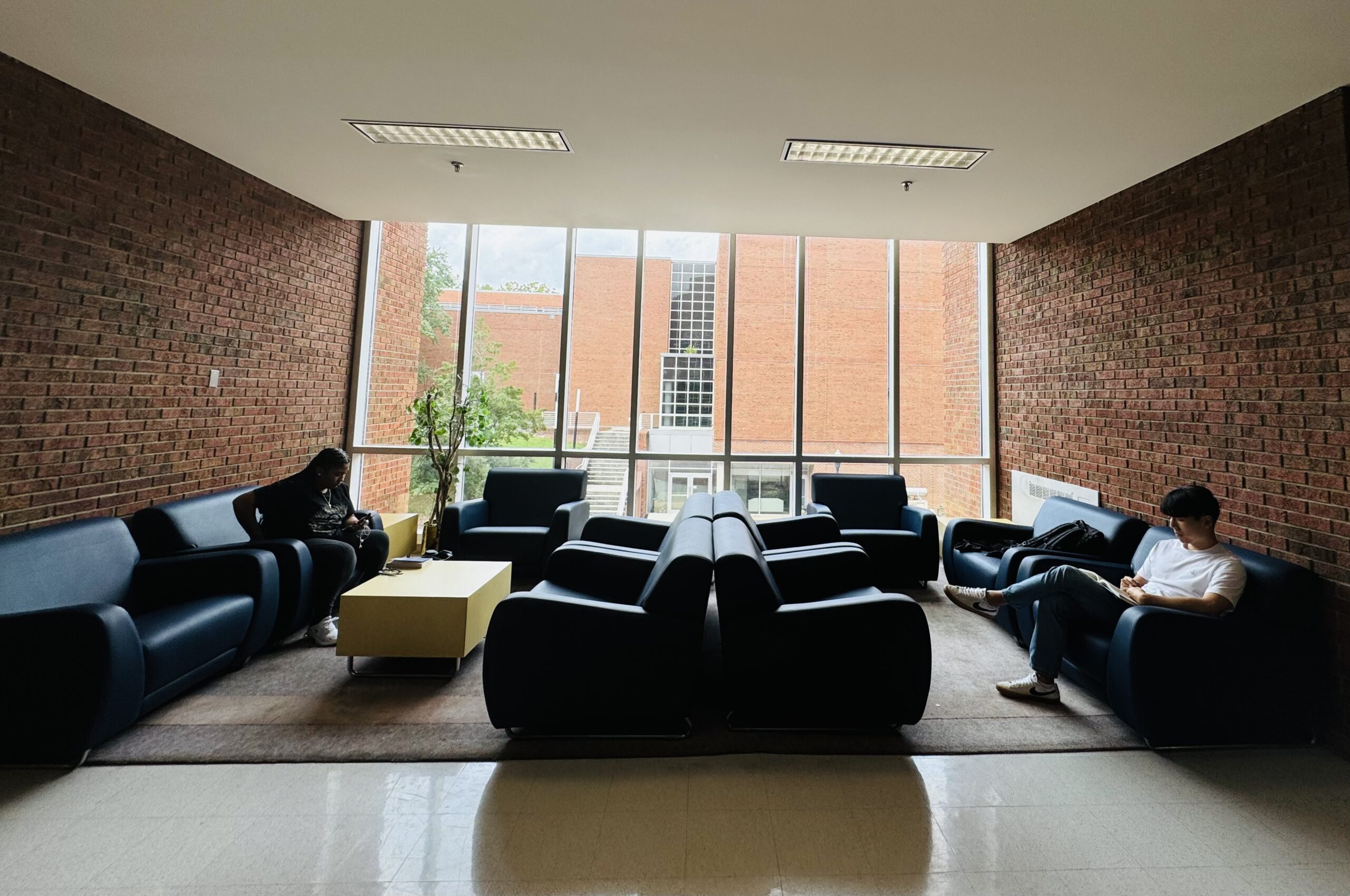 Two students in an empty lounge
