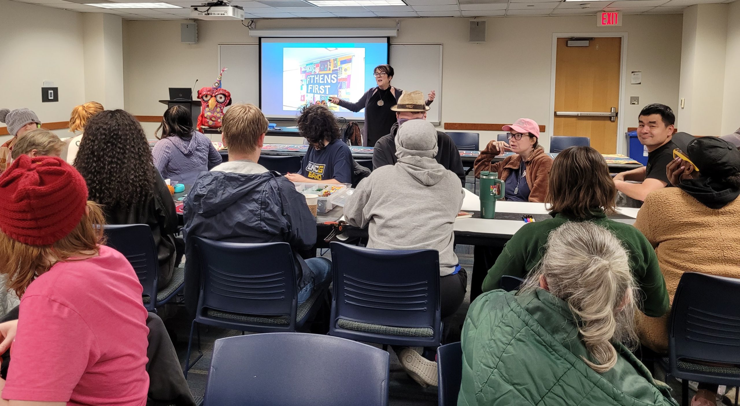 Dr. Lynn Harter, a guest from Ohio University by the Communication Studies department, leads a workshop on being different together through community quilt-making.