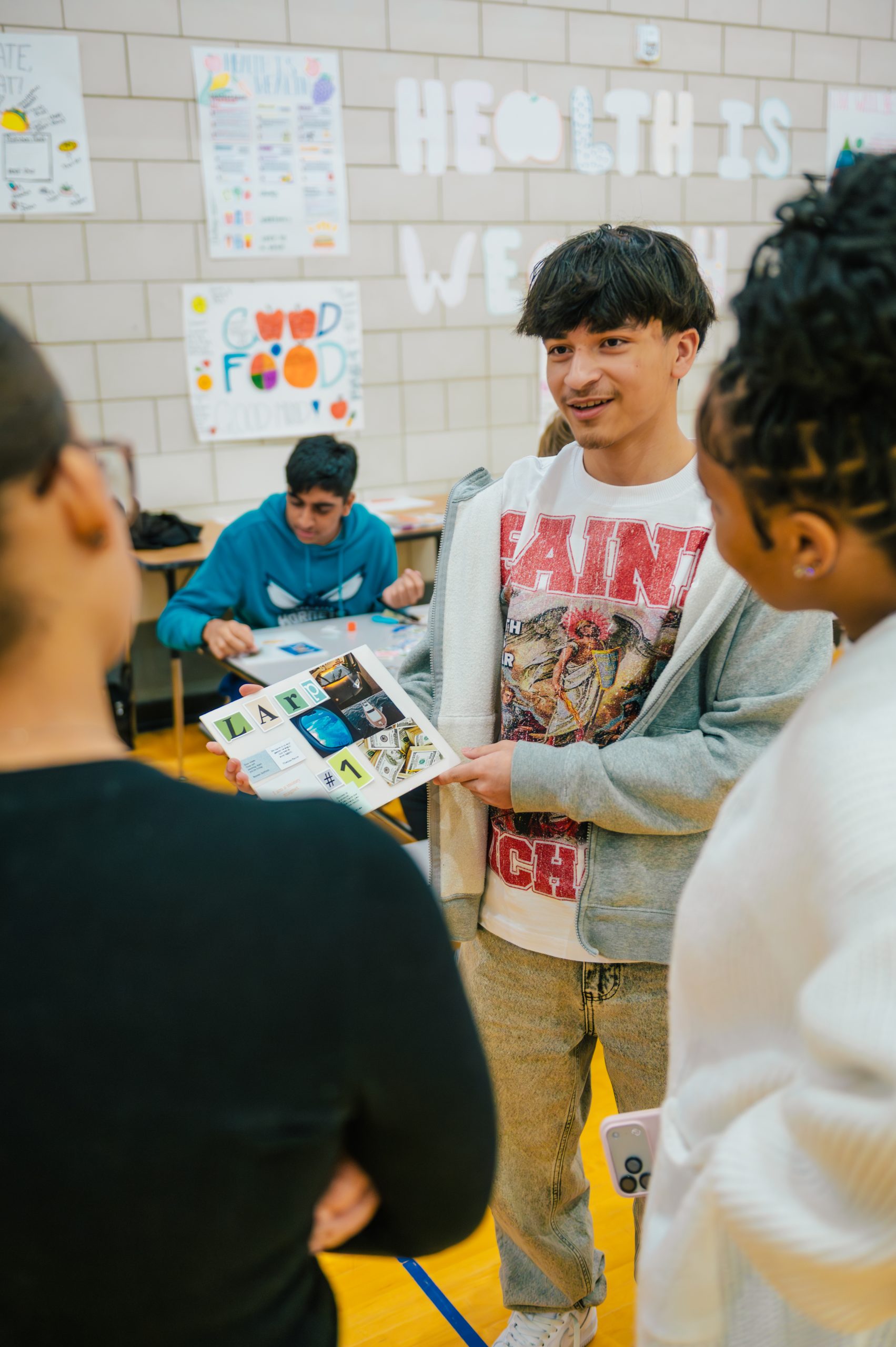 A student shows of his vision board during a seminar/workshop on mental health