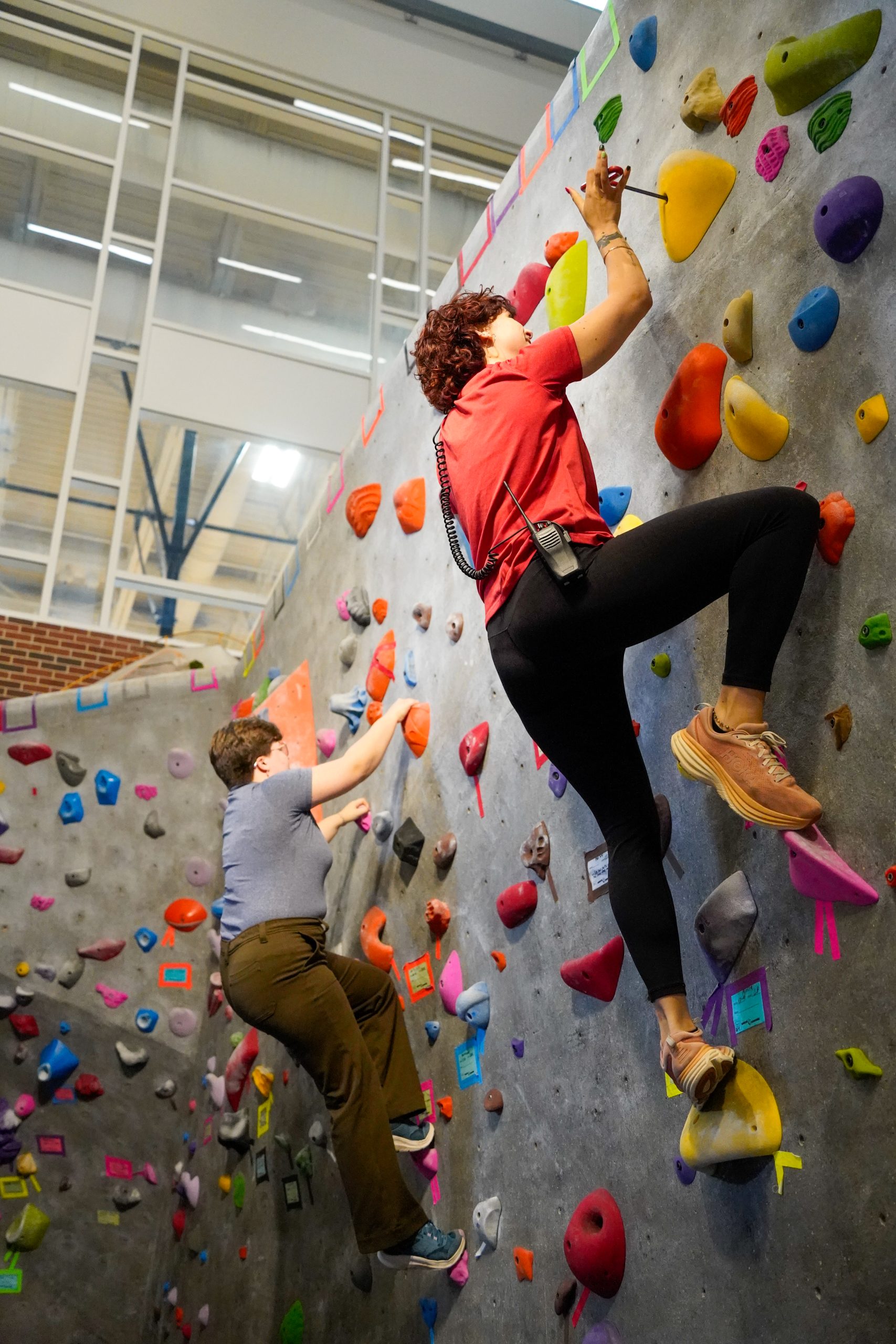 A student climbs the wall at the Kaplan Center.