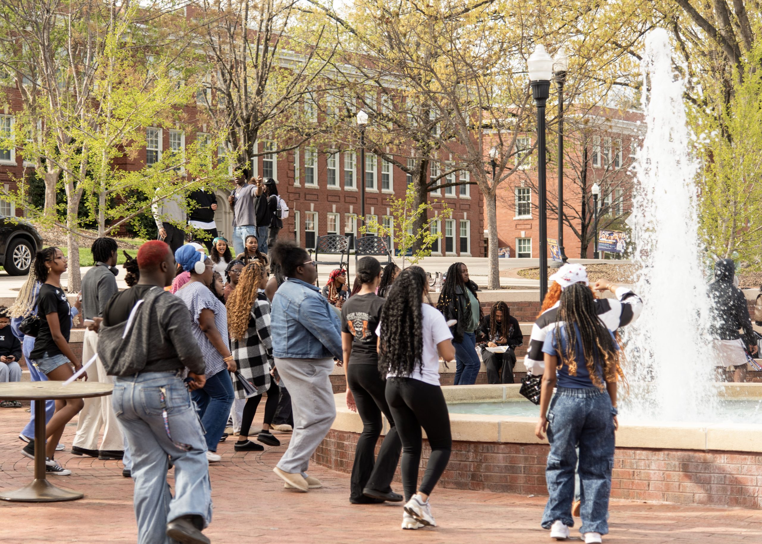 DJ Dwayne gets students up and dancing at Femme at the Fountain event.