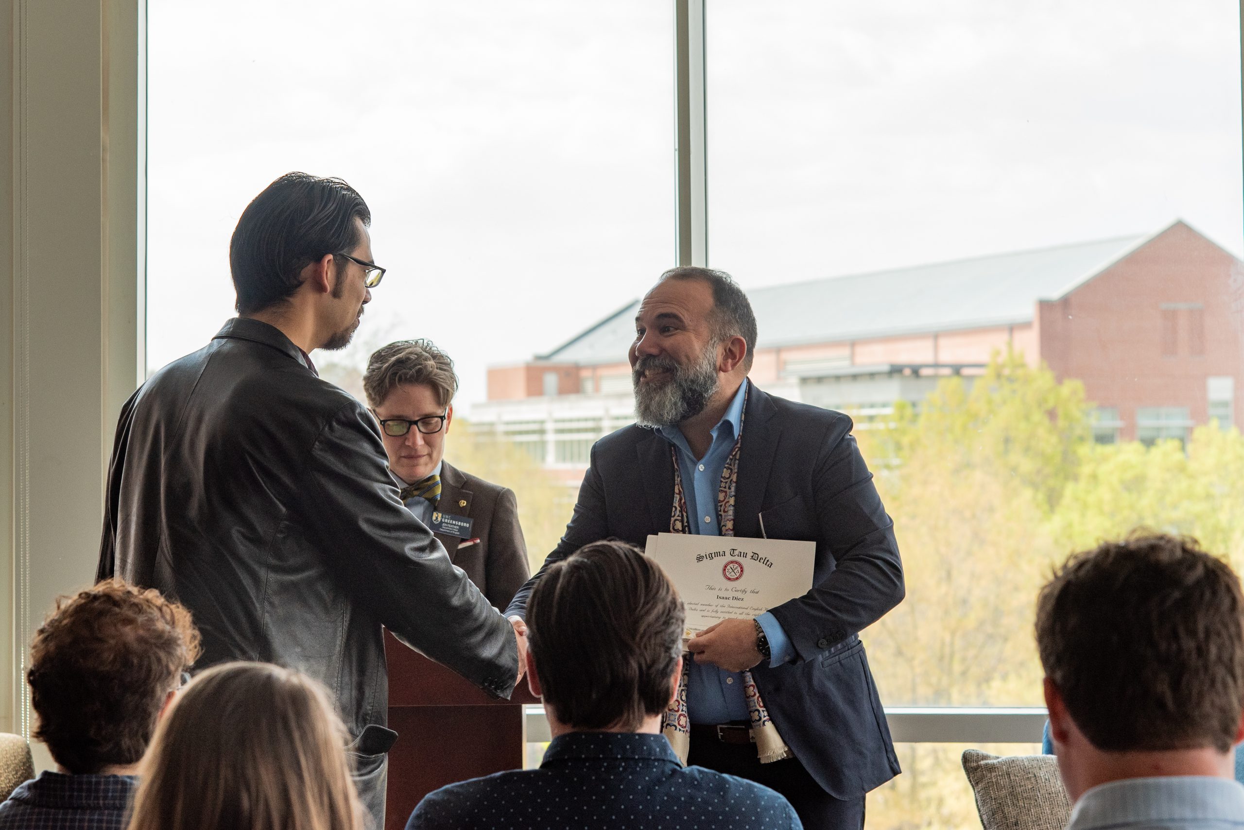 Jen Feather and Anthony Cuda present certificate during SigmaTau Delta Induction Ceremony