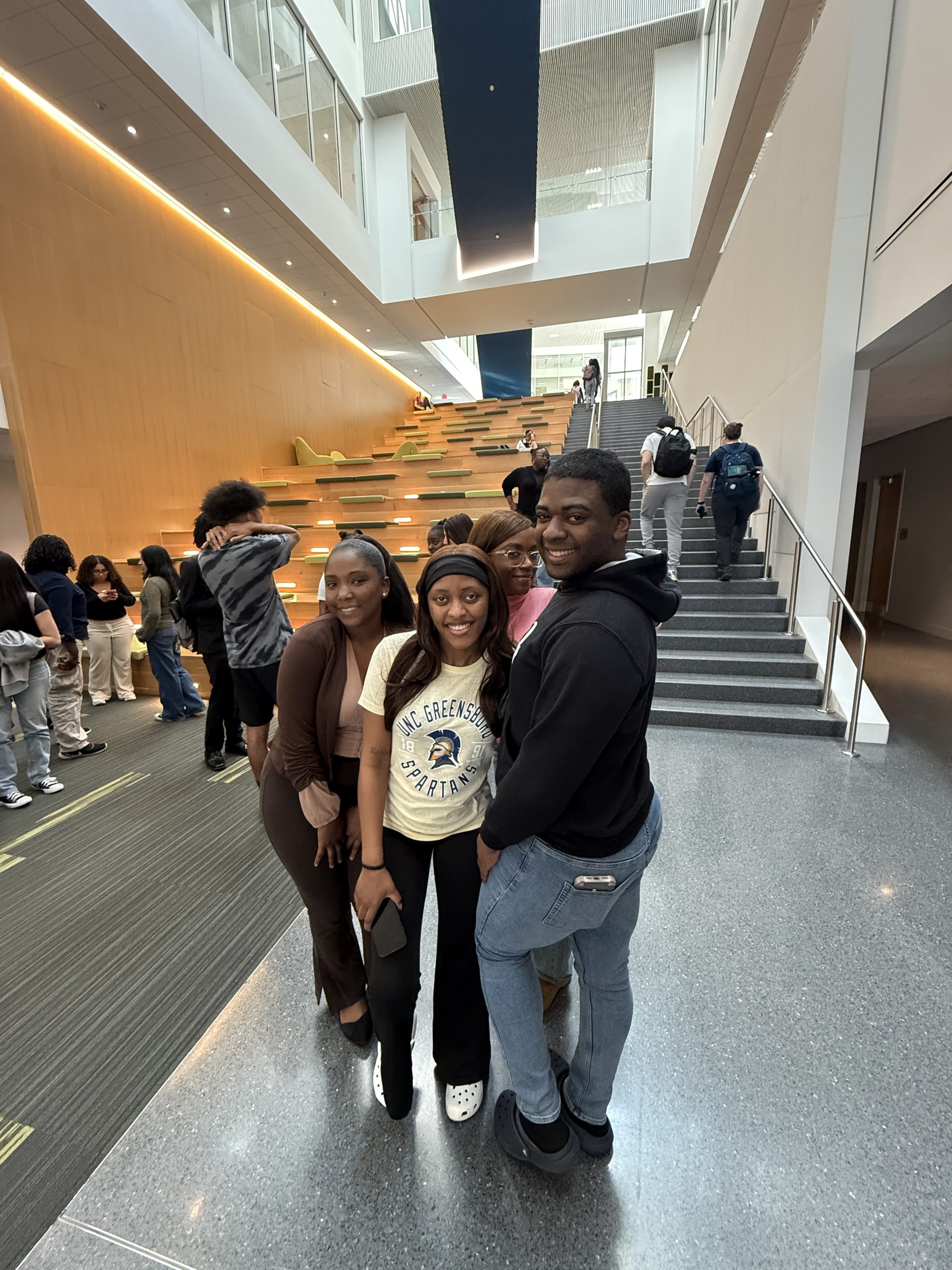 Group of students in the stairatorium in the NIB.
