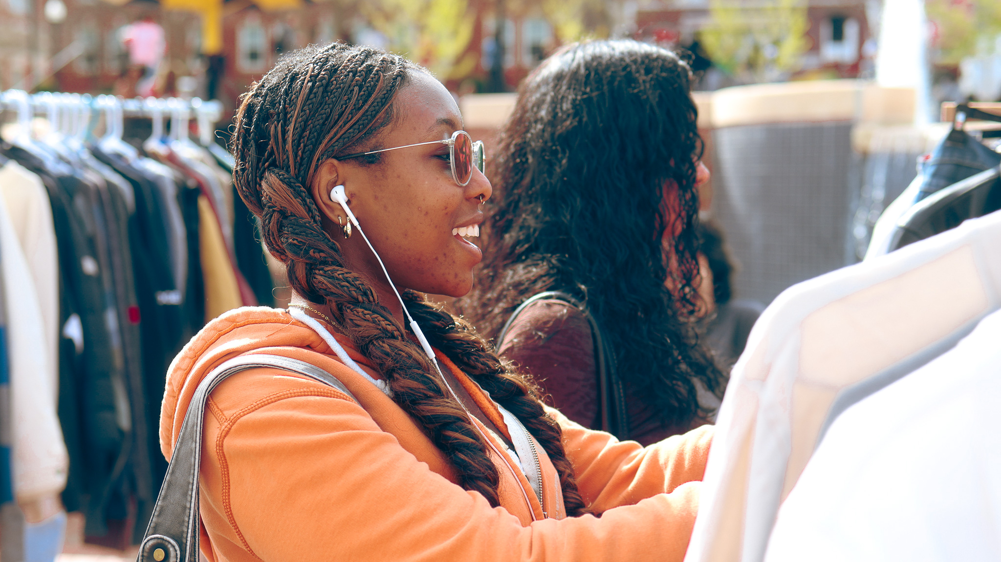 Students converse as they browse a student-organized pop-up shop.