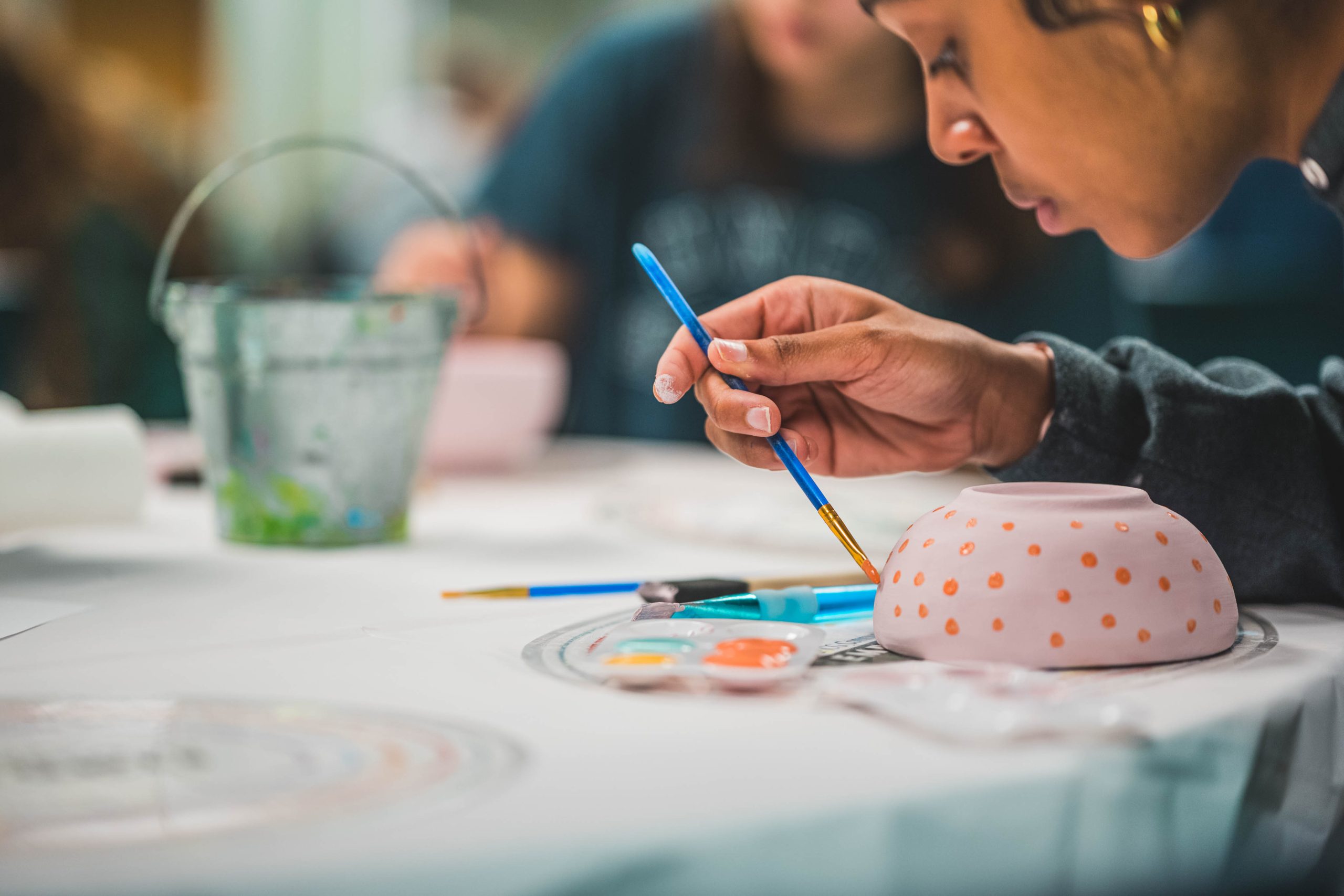 A student focuses on the details during a UNCG tradition to help end food insecurity on campus.