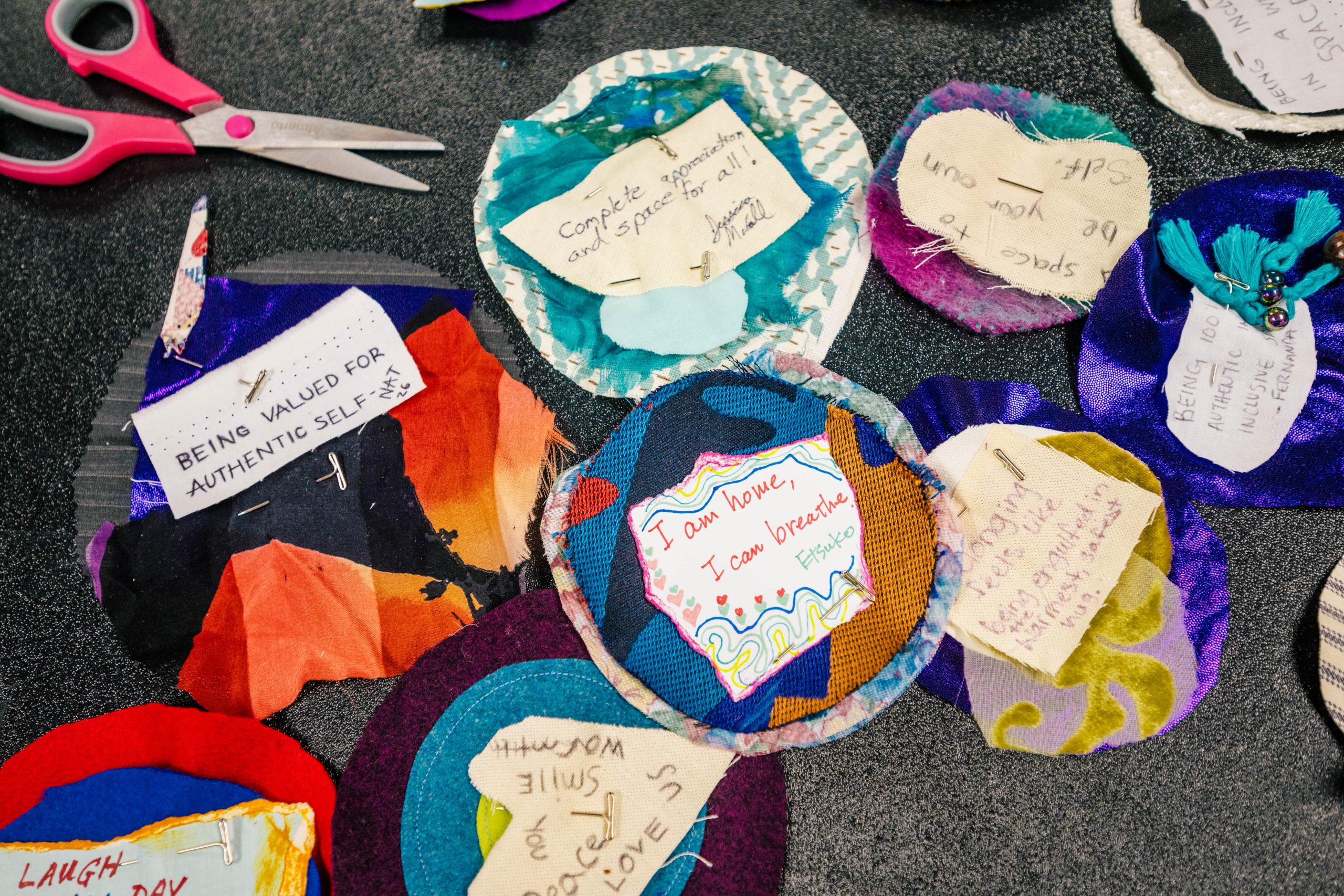 Quilted messages made by students as part of Communication Studies' Harriet Elliott Lecture Series.