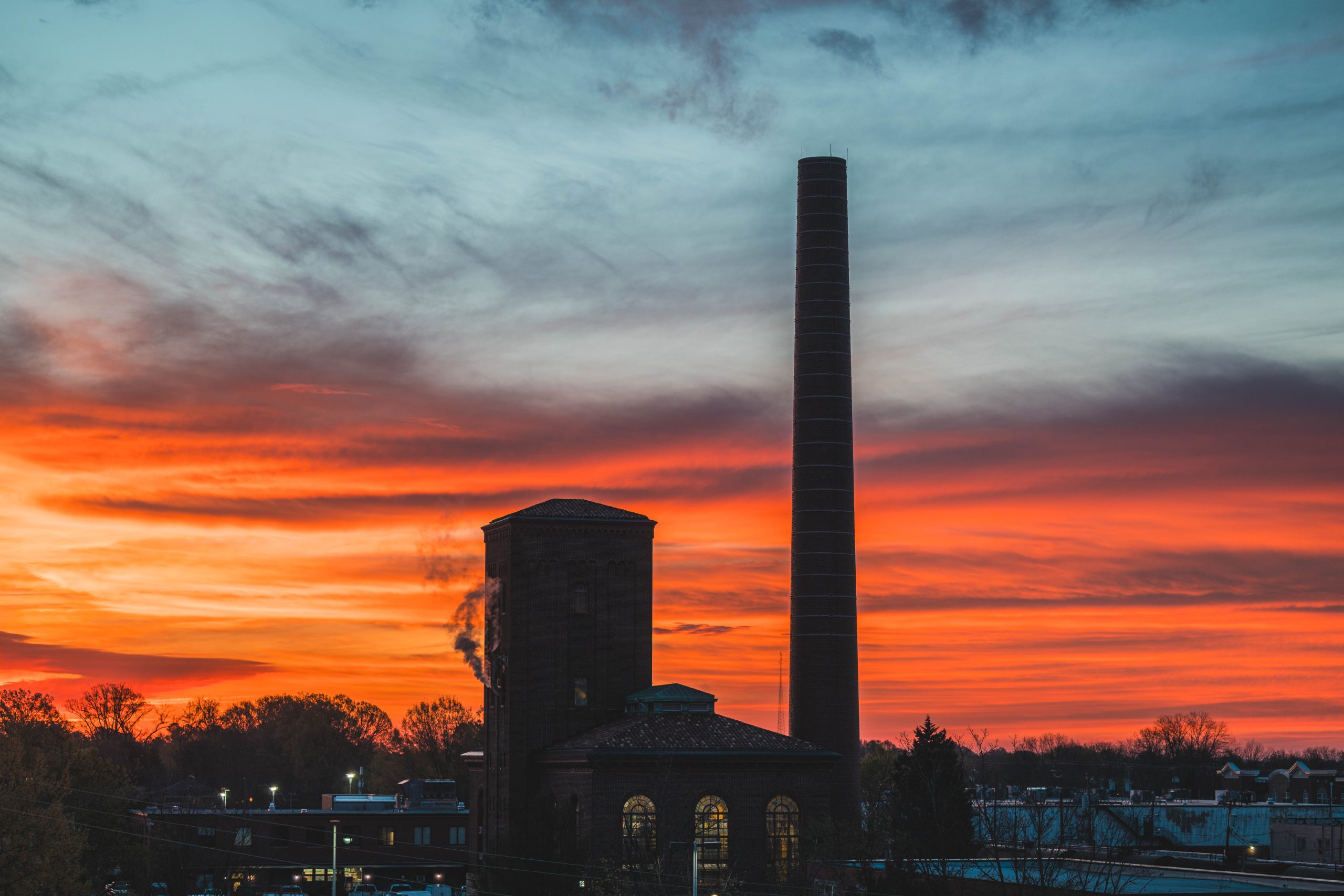 An orange sunrise lit UNCG's Sink Building on Wednesday morning.