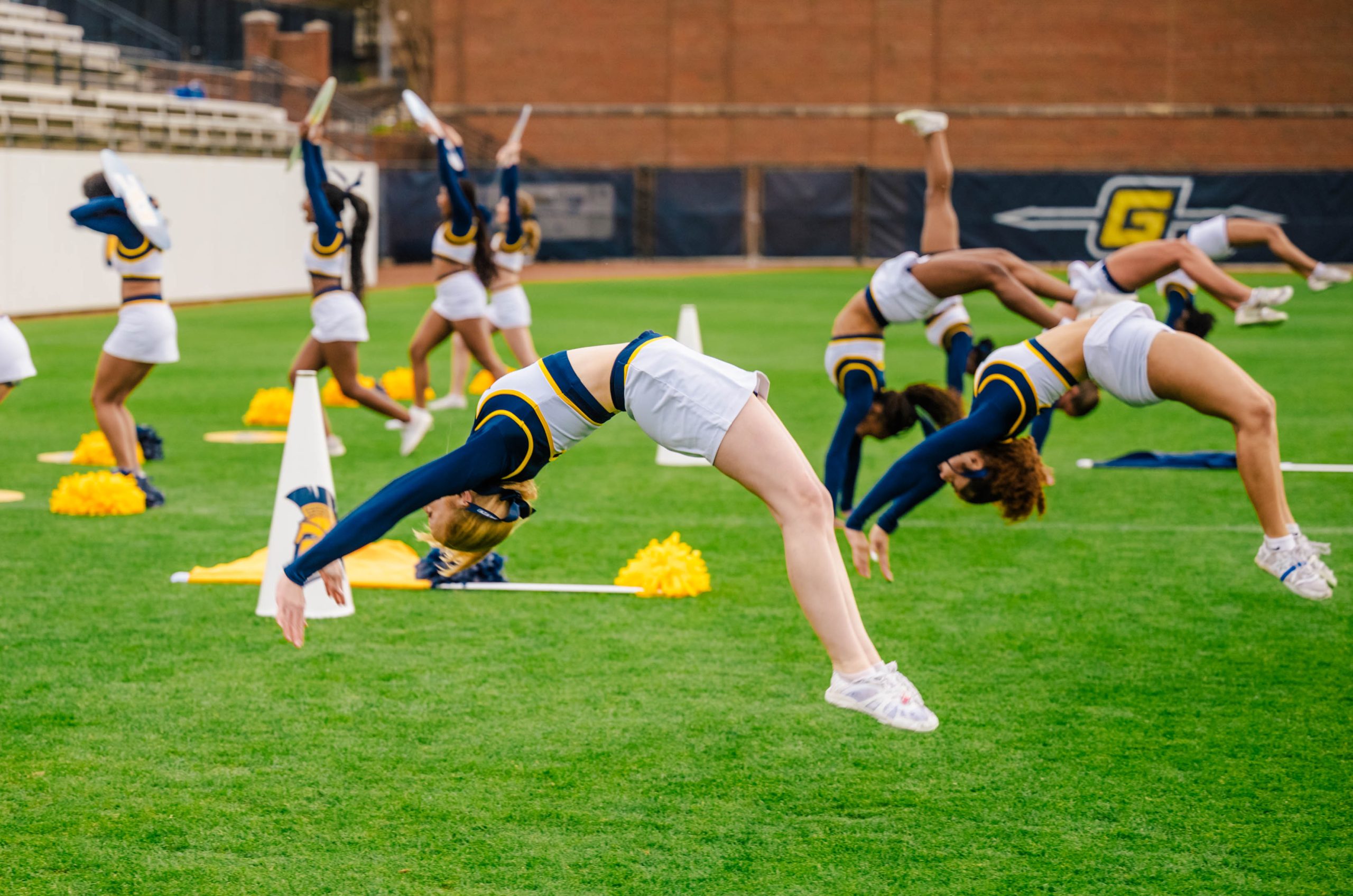 The UNCG Cheer Squad practices its routine in preparation for the Light The Way Campaign Close Event.