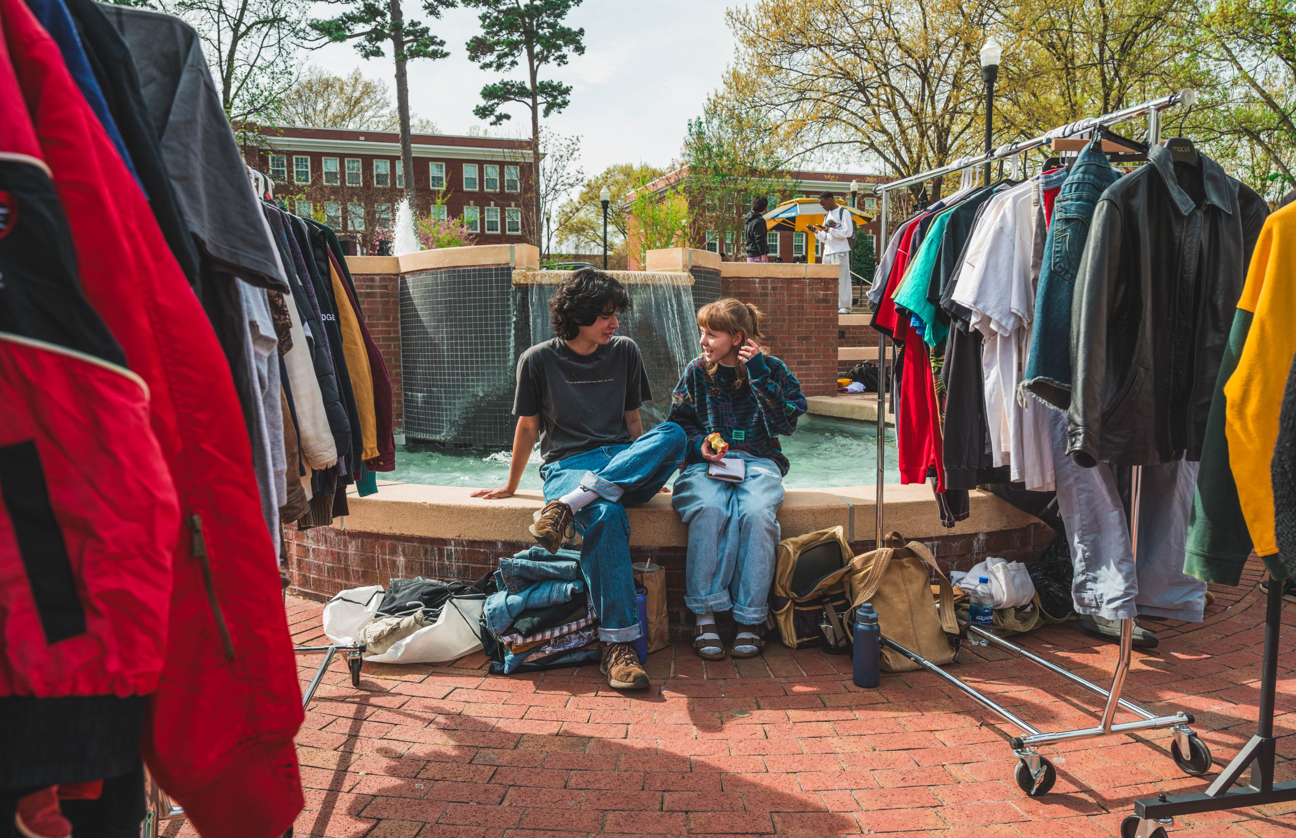 Thrifty student vendors set up shop at "The Fountain" at Moran commons on Wednesday afternoon, selling vintage clothing to UNCG students.