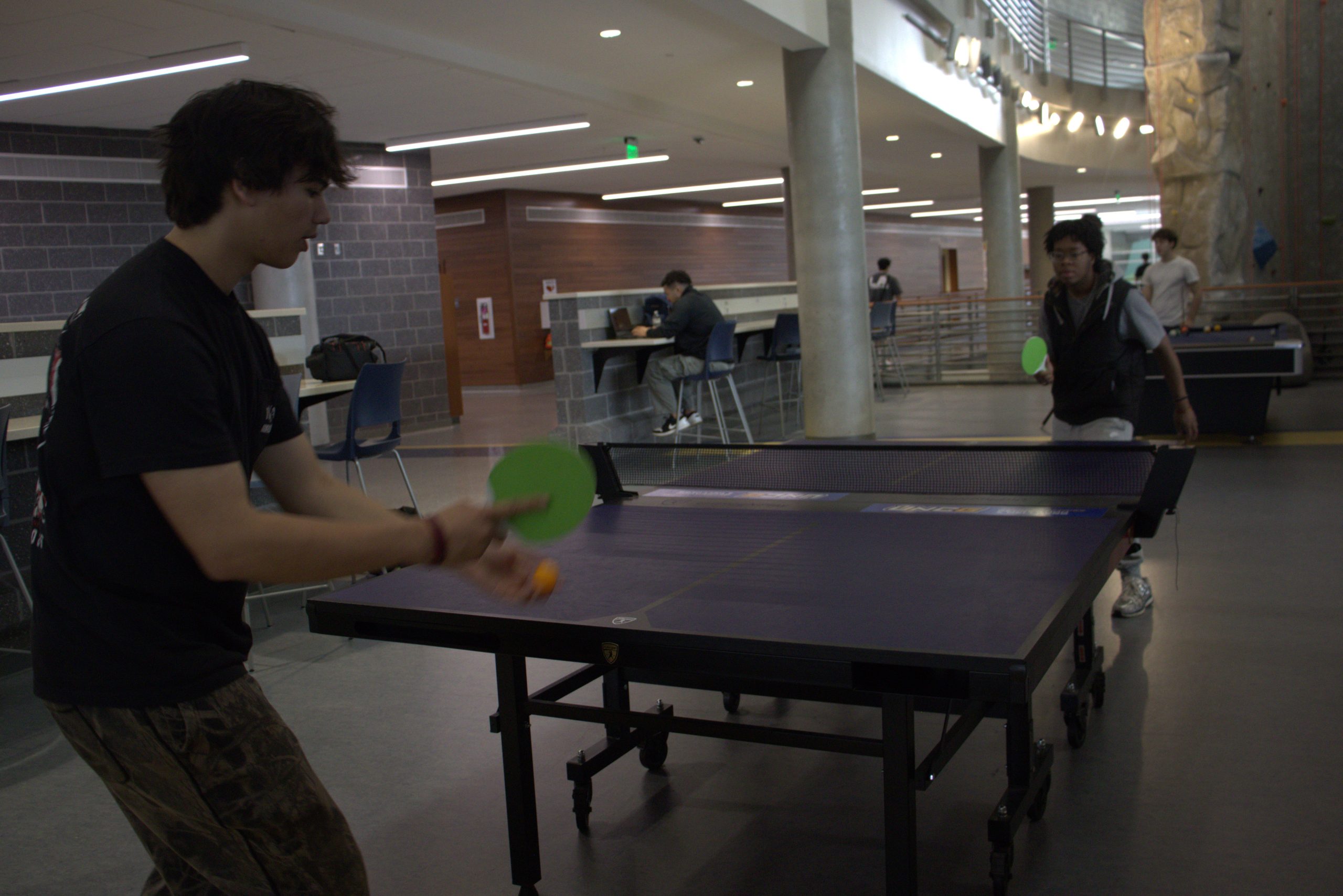 A friendly game of ping-pong at the Kaplan Center.