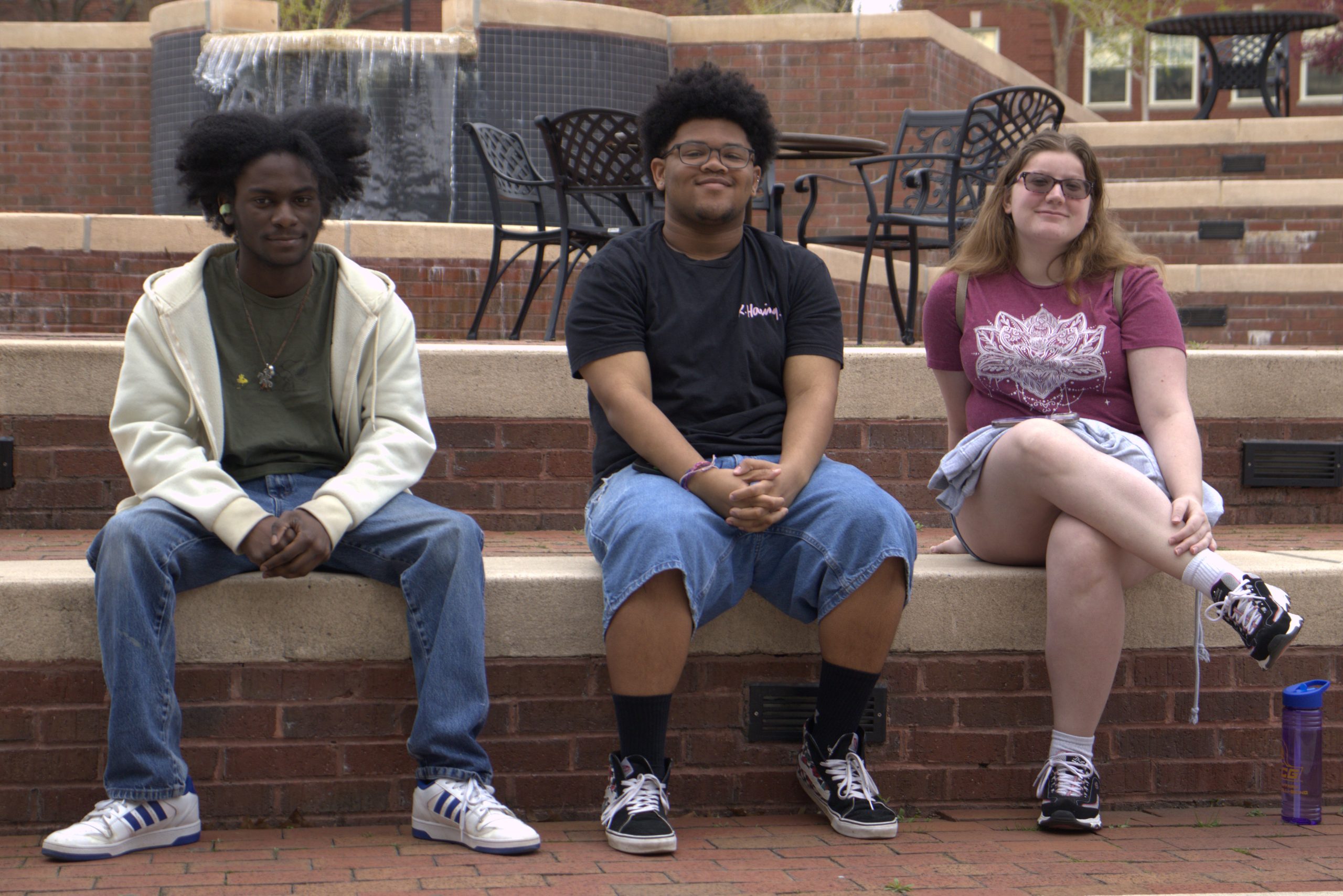 Students relax by the fountain