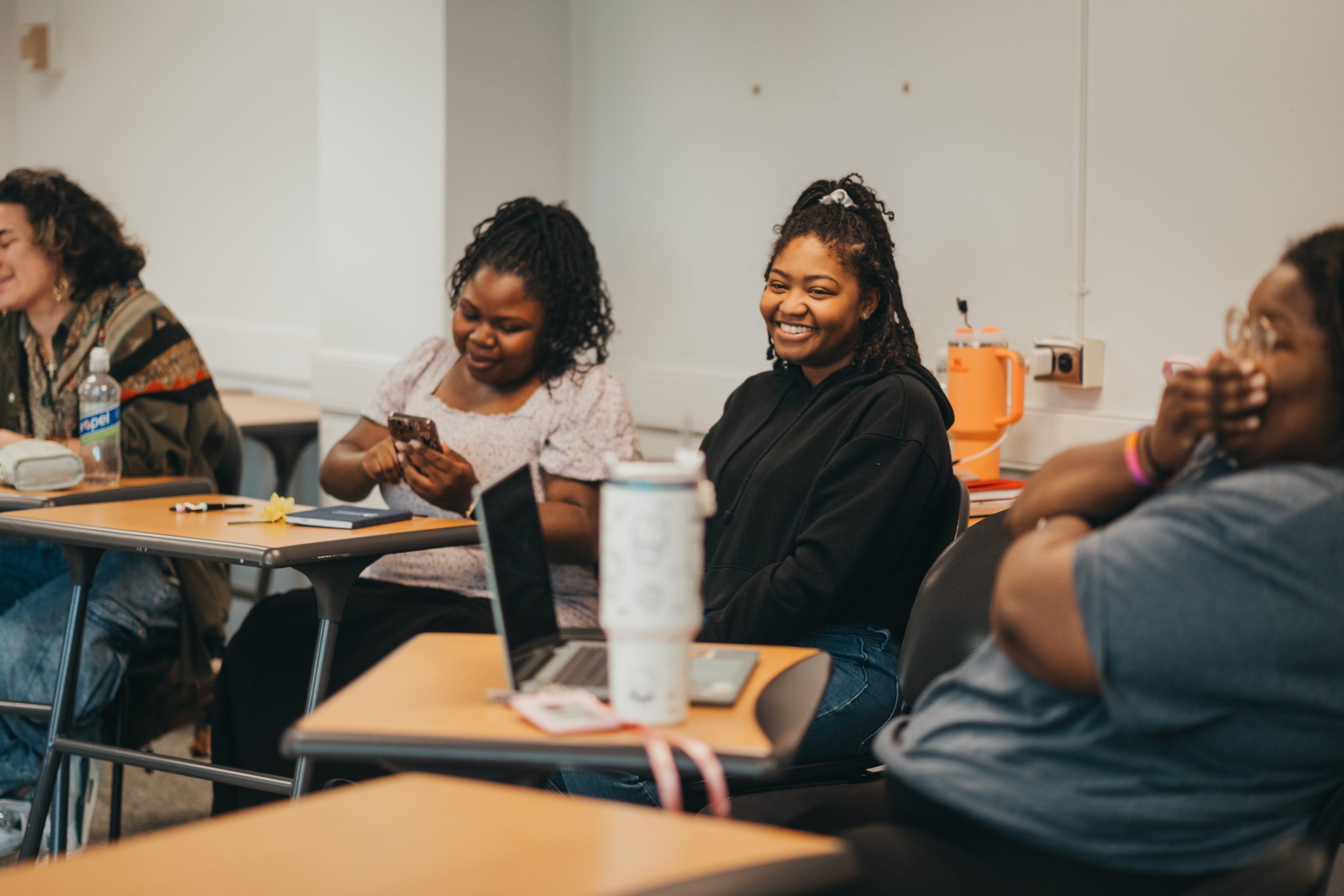 Laughter punctuates a discussion amongst social work students.