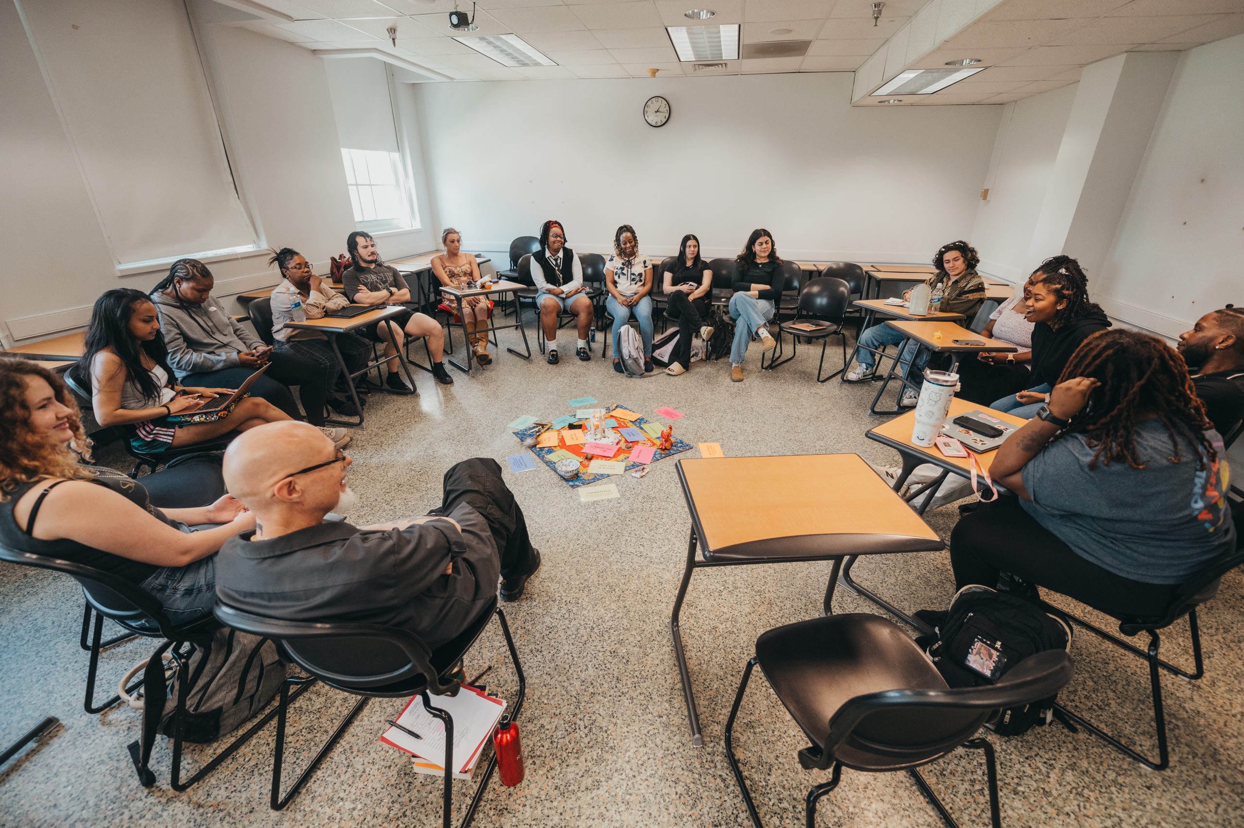 A social work class conducts a Peacemaking Circle, led by Associate Professor Daniel Rhodes.